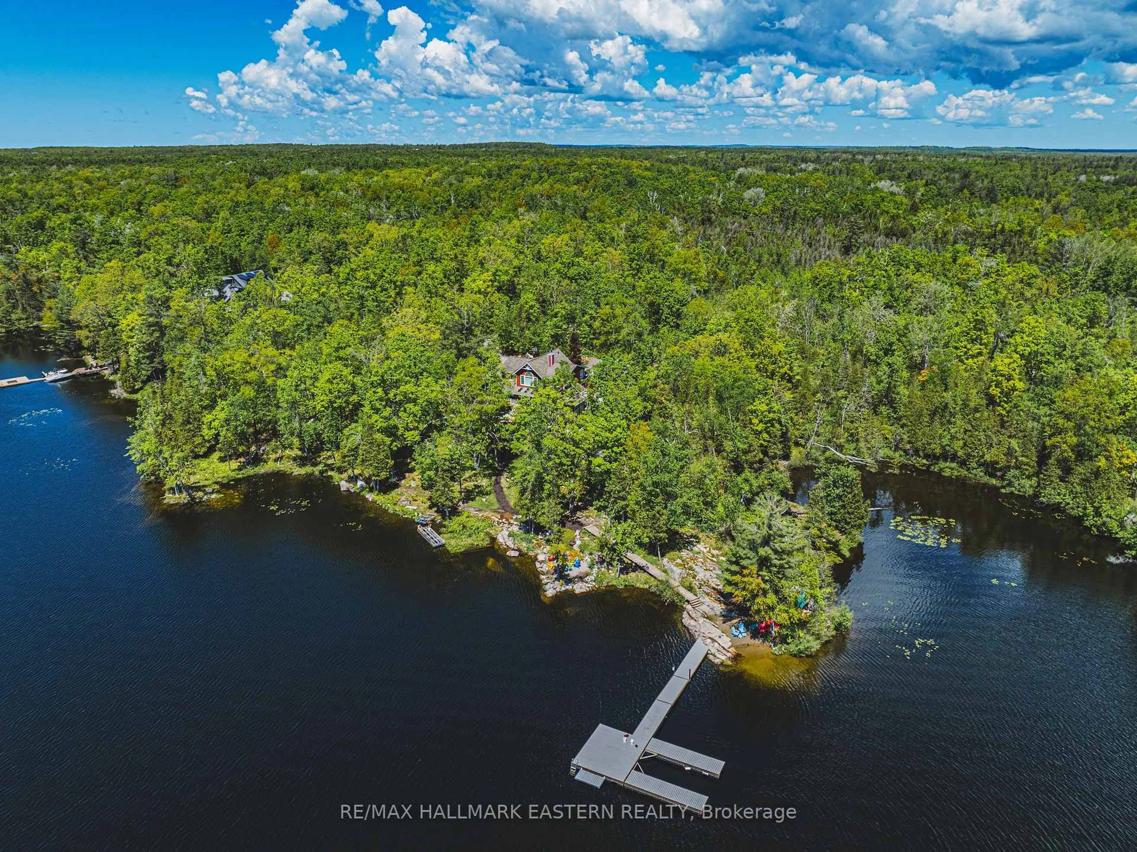 A pic from outside/outdoor area/front of a property/back of a property/a pic from drone, water/lake/river/ocean view for 22 Fraser Estates Lane, North Kawartha Ontario K0L 3E0