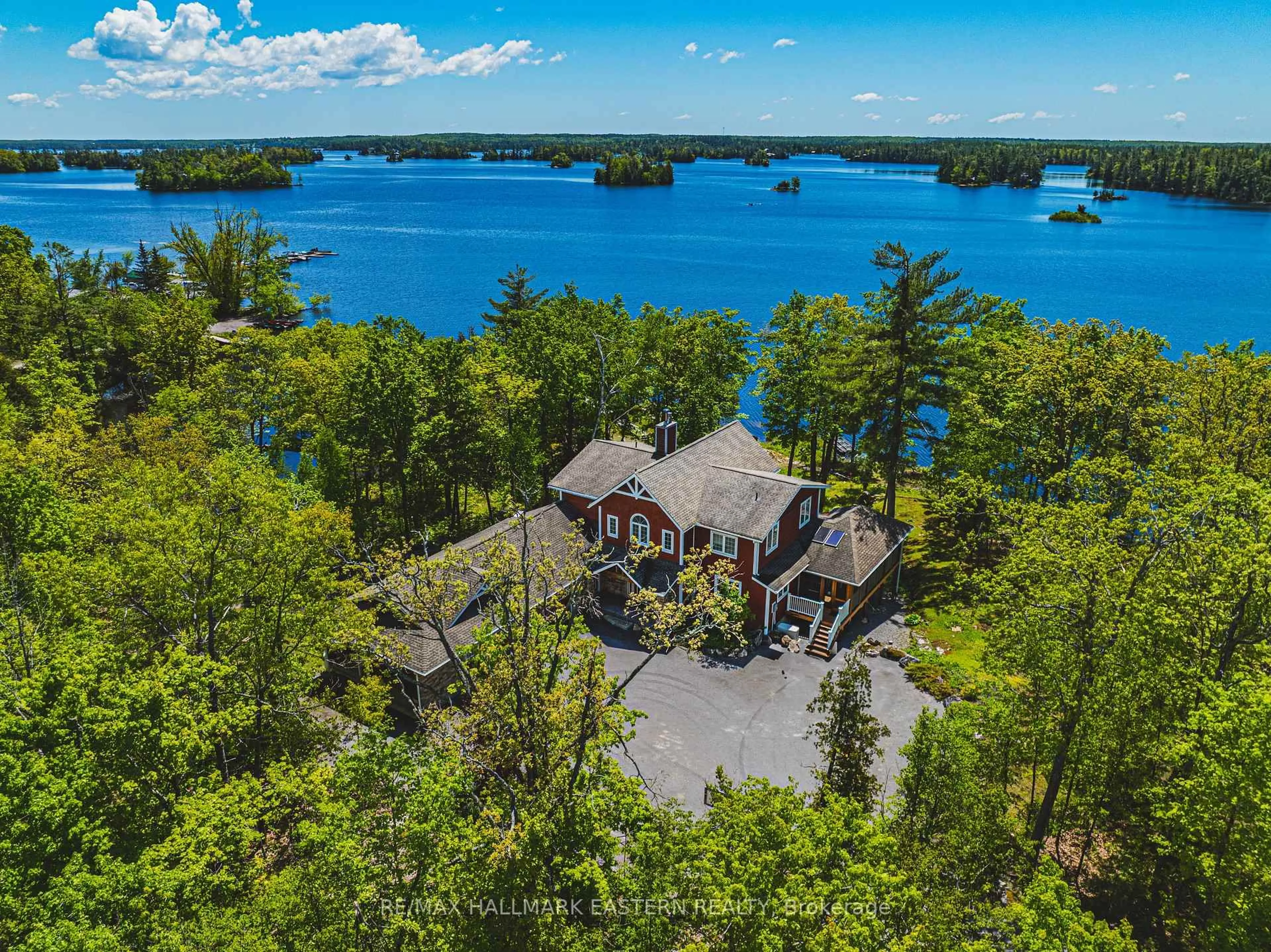 A pic from outside/outdoor area/front of a property/back of a property/a pic from drone, water/lake/river/ocean view for 22 Fraser Estates Lane, North Kawartha Ontario K0L 3E0