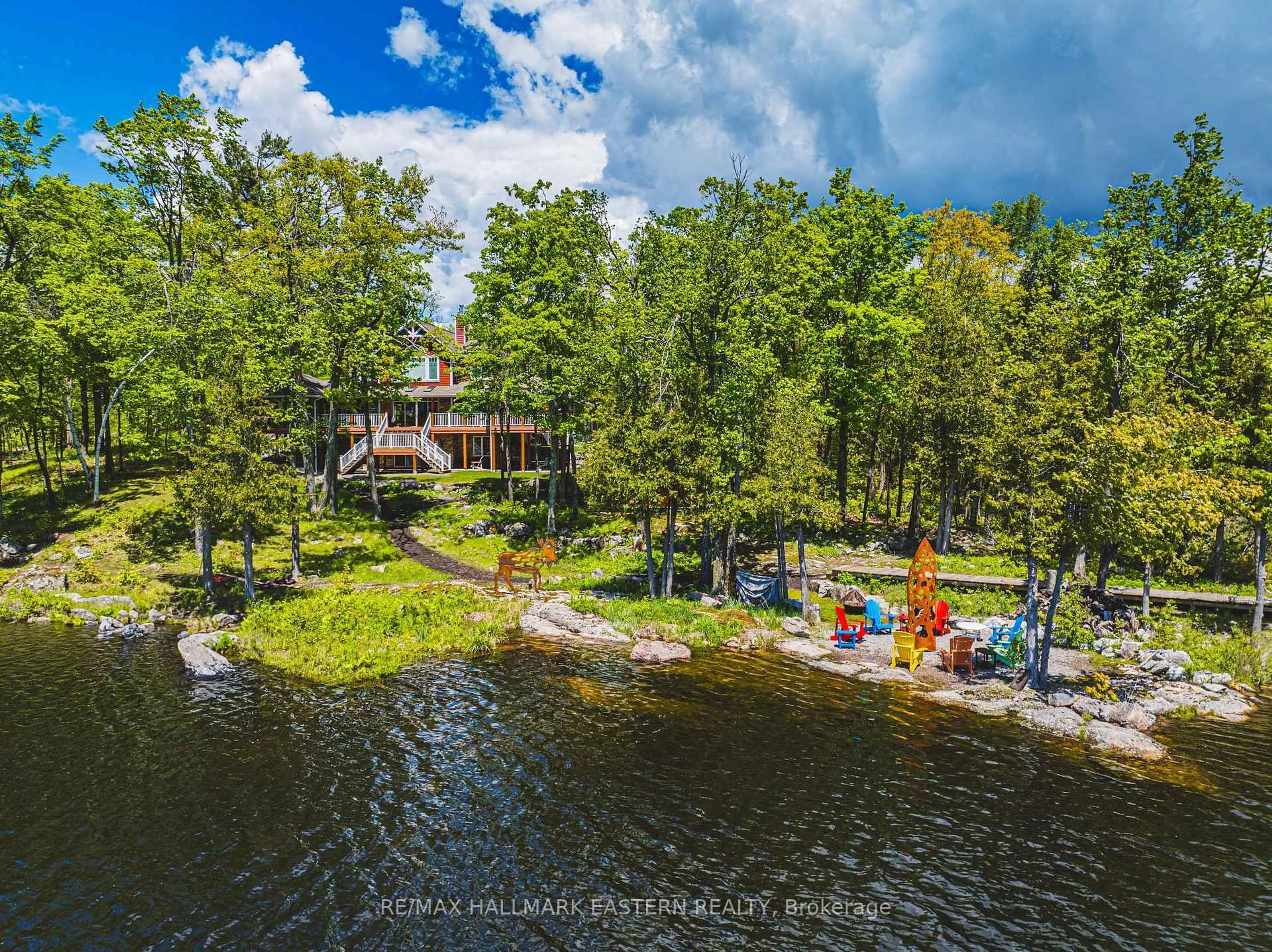 A pic from outside/outdoor area/front of a property/back of a property/a pic from drone, water/lake/river/ocean view for 22 Fraser Estates Lane, North Kawartha Ontario K0L 3E0