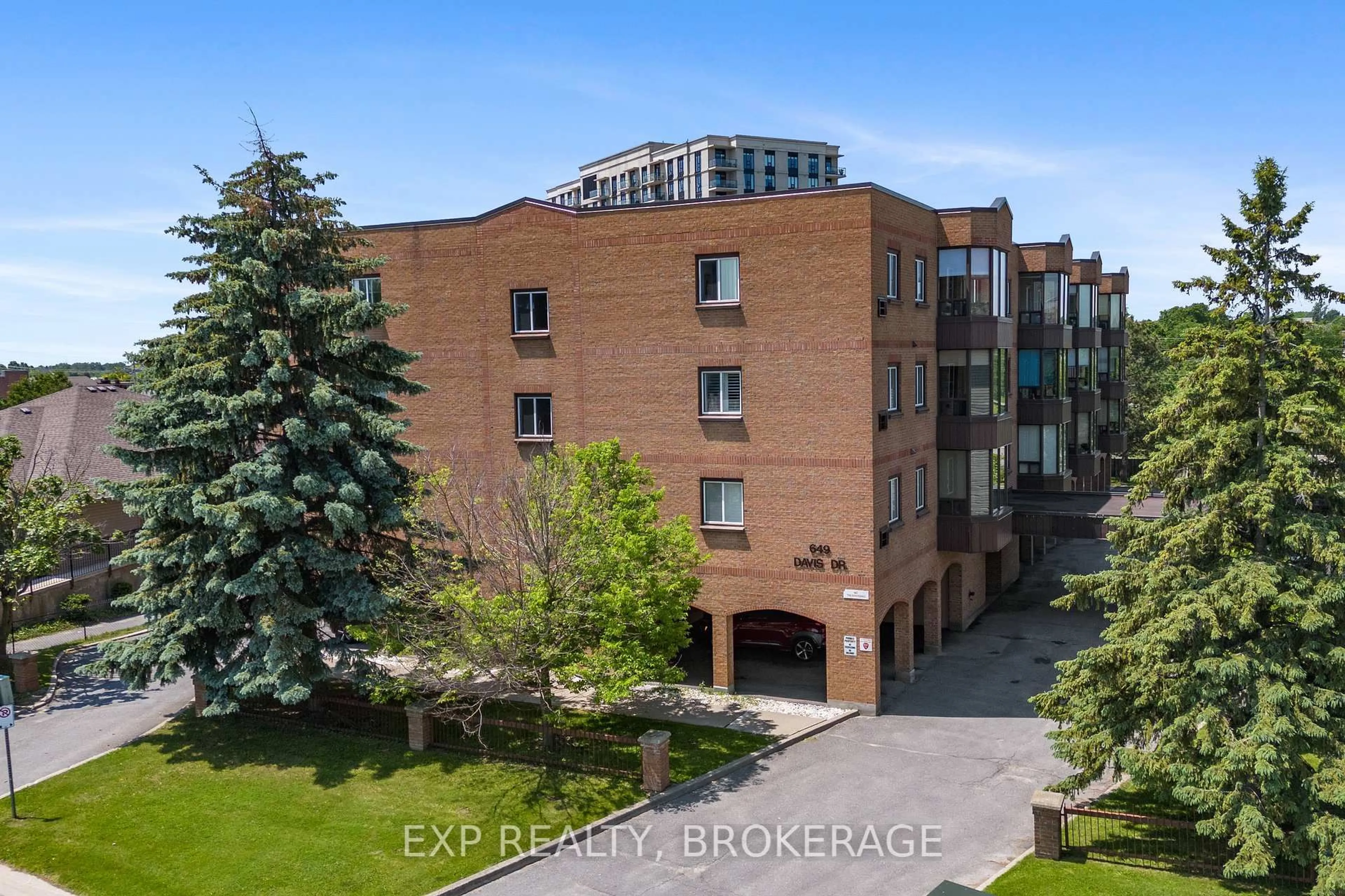 A pic from outside/outdoor area/front of a property/back of a property/a pic from drone, building for 649 Davis Dr #401, Kingston Ontario K7M 8J3