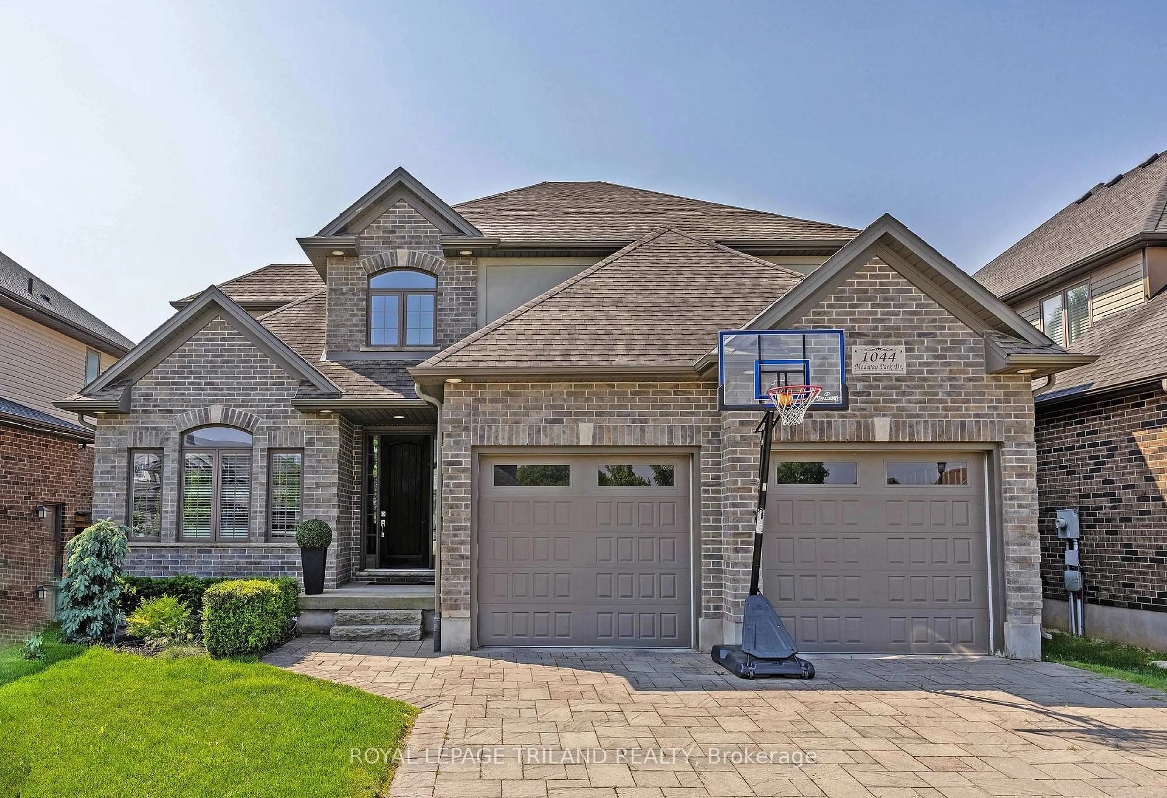 Home with brick exterior material, street for 1044 Medway Park Dr, London North Ontario N6G 0E4