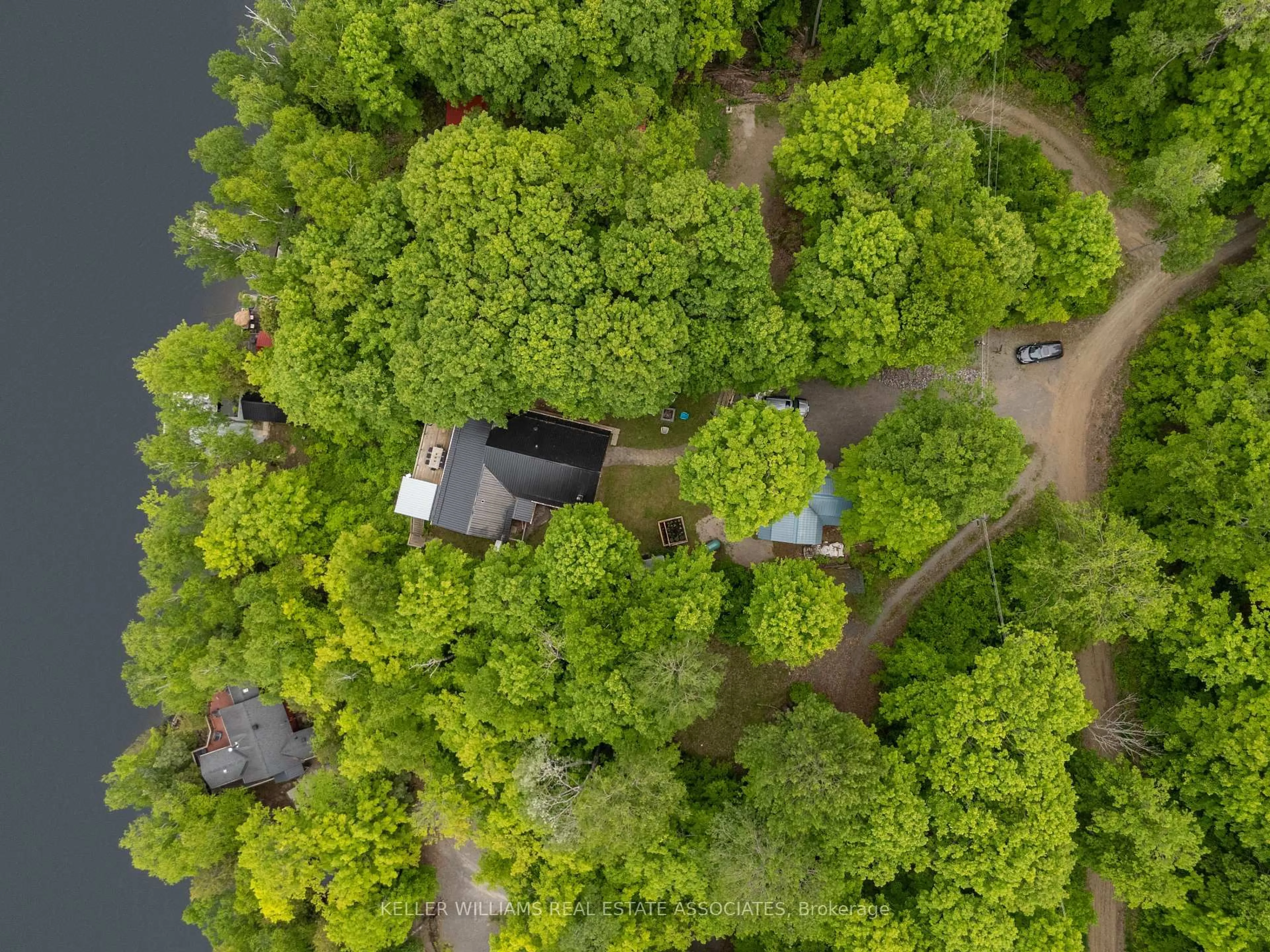 A pic from outside/outdoor area/front of a property/back of a property/a pic from drone, forest/trees view for 398 Gilbert Bay Lane, Coe Hill Ontario K0L 1P0