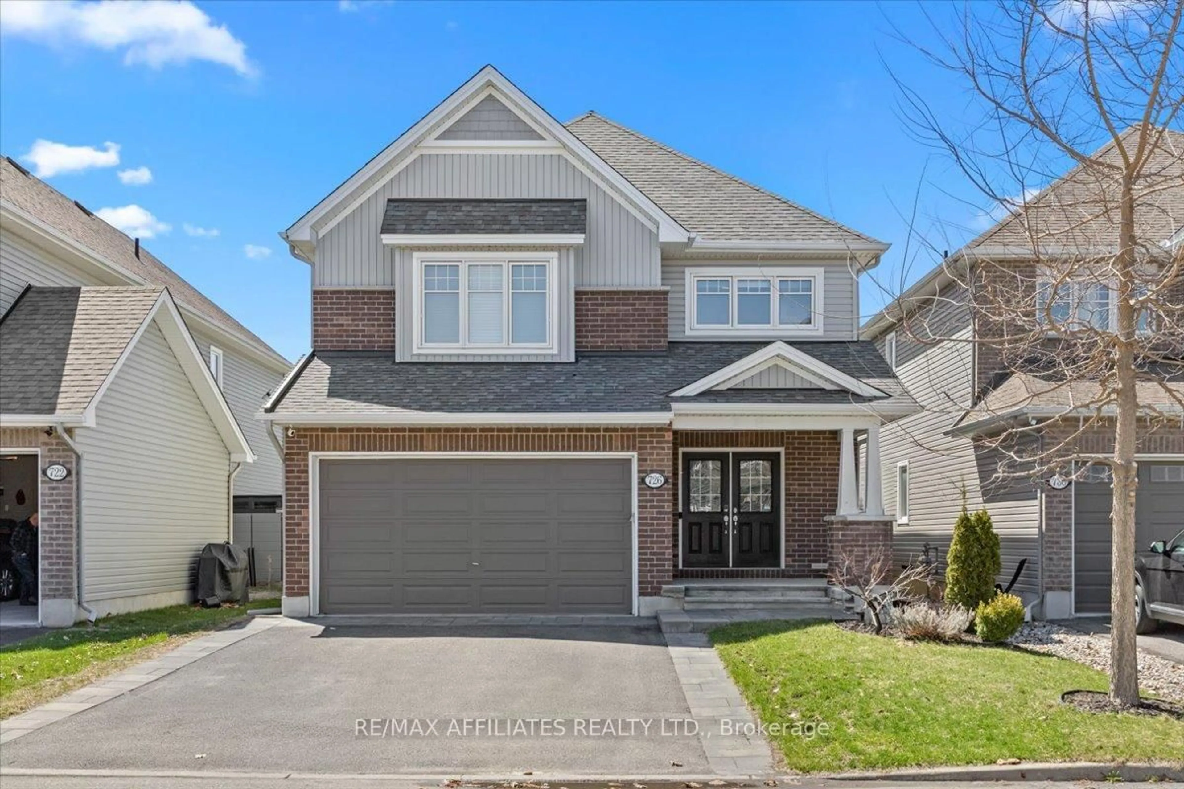 Home with brick exterior material, street for 726 Bunchberry Way, Ottawa Ontario K1T 3T8