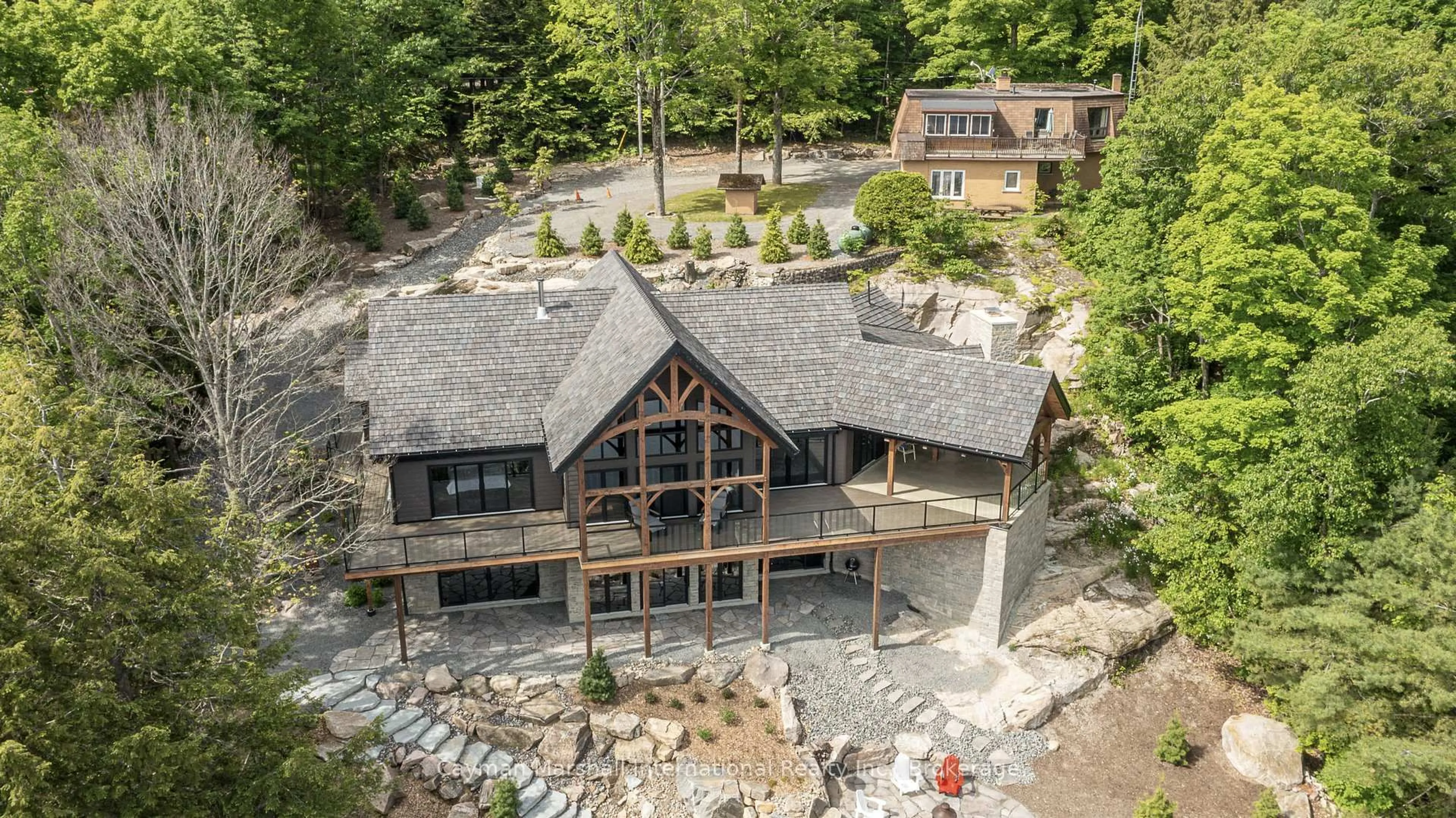 A pic from outside/outdoor area/front of a property/back of a property/a pic from drone, water/lake/river/ocean view for 1668 Beaumont Dr, Bracebridge Ontario P1L 1X2