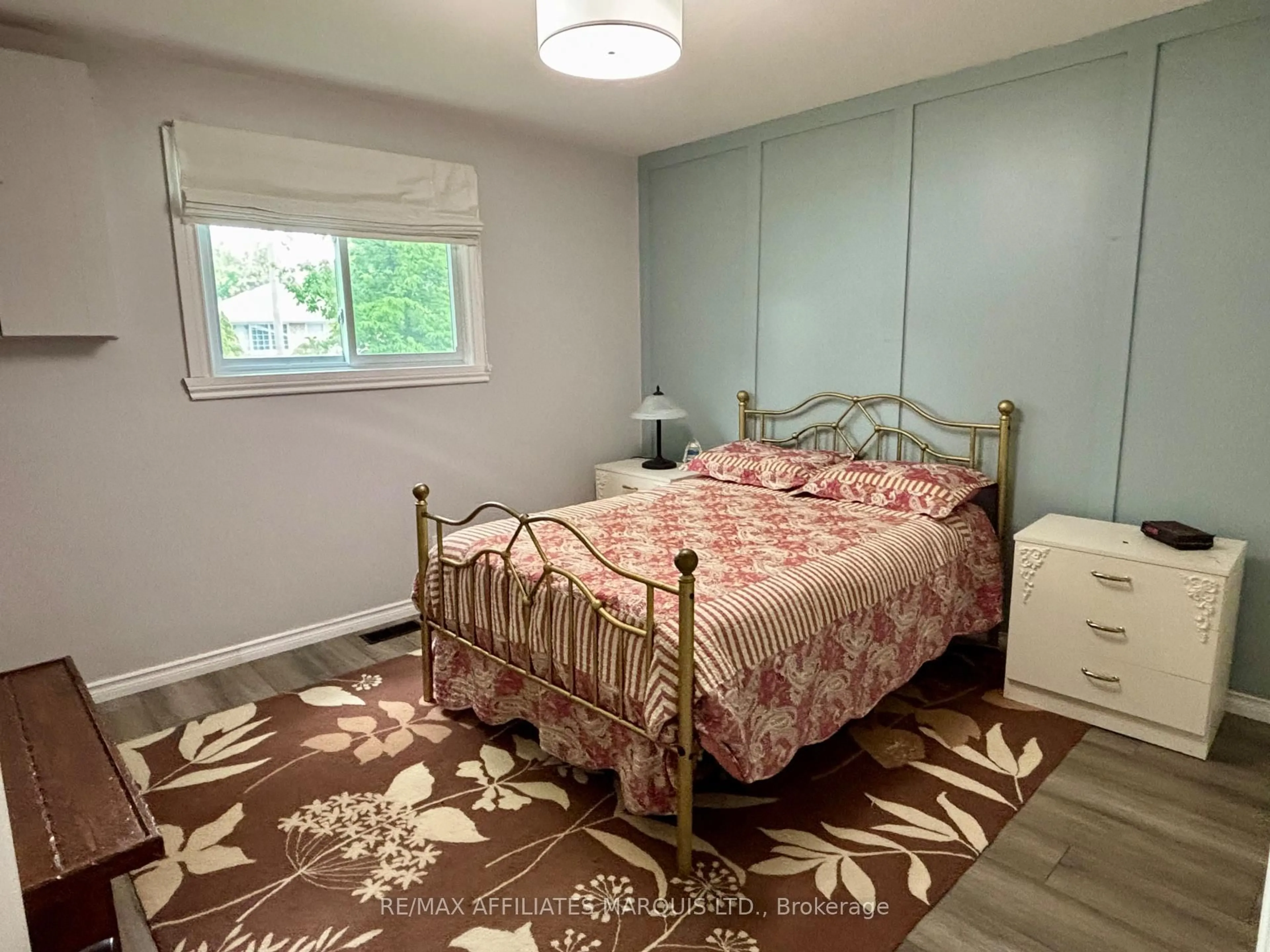 Bedroom with bed, wood/laminate floor for 1005 Osborne Ave, Cornwall Ontario K6J 1K8