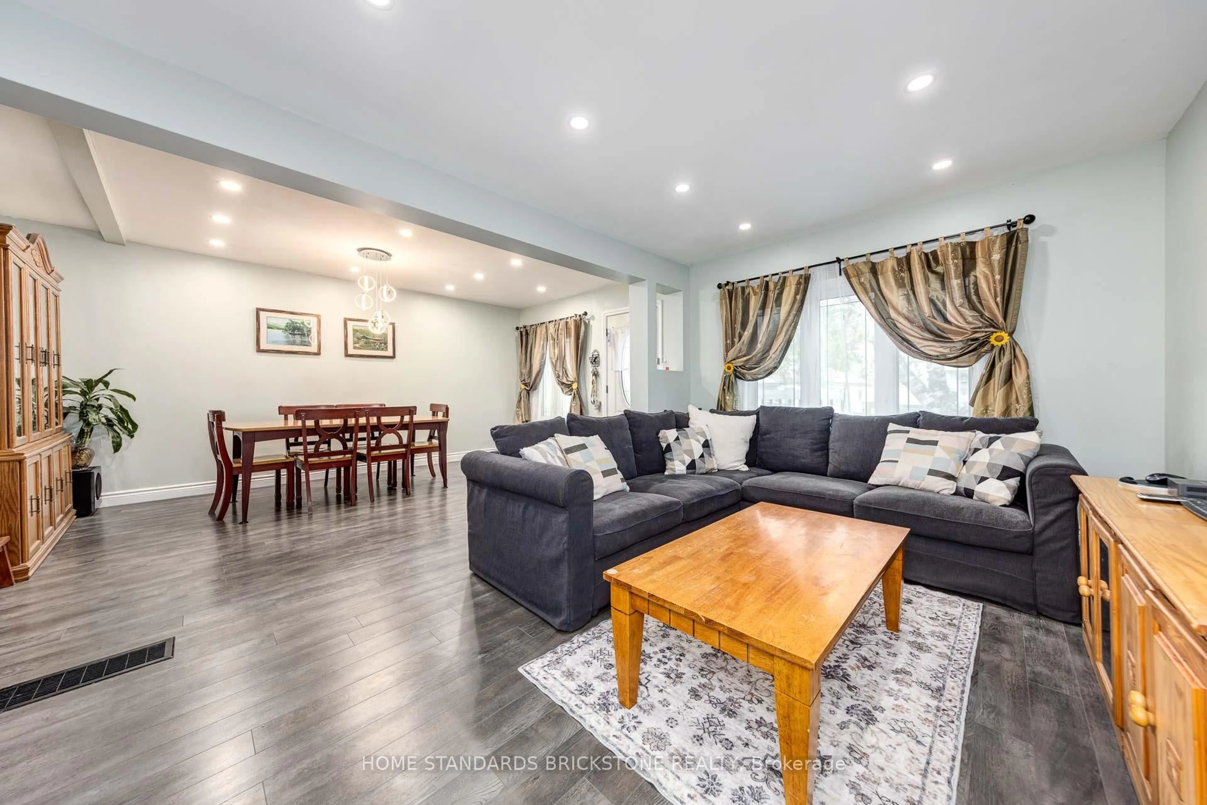 Living room with furniture, wood/laminate floor for 140 Walter Ave, Hamilton Ontario L8K 3K9