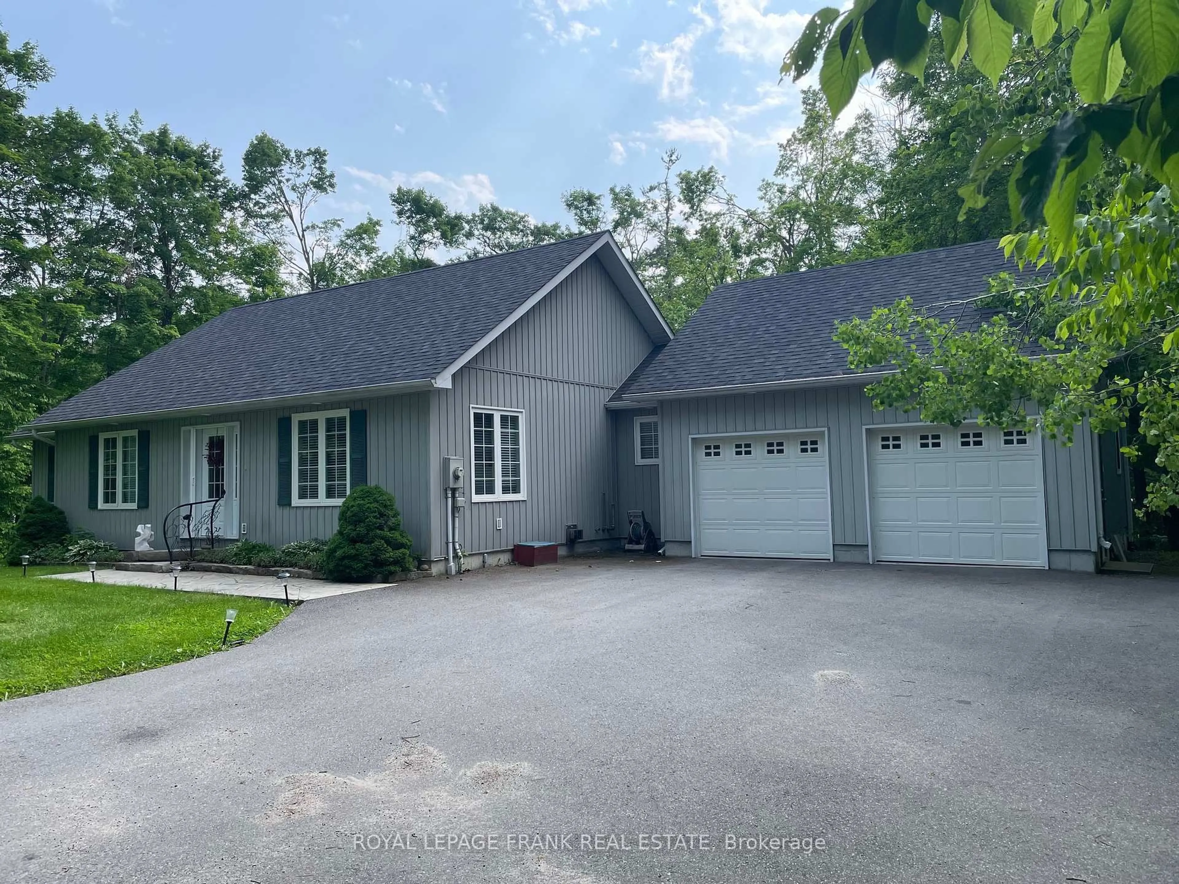 Home with vinyl exterior material, street for 18 East Beehive Dr, Kawartha Lakes Ontario K0M 1A0