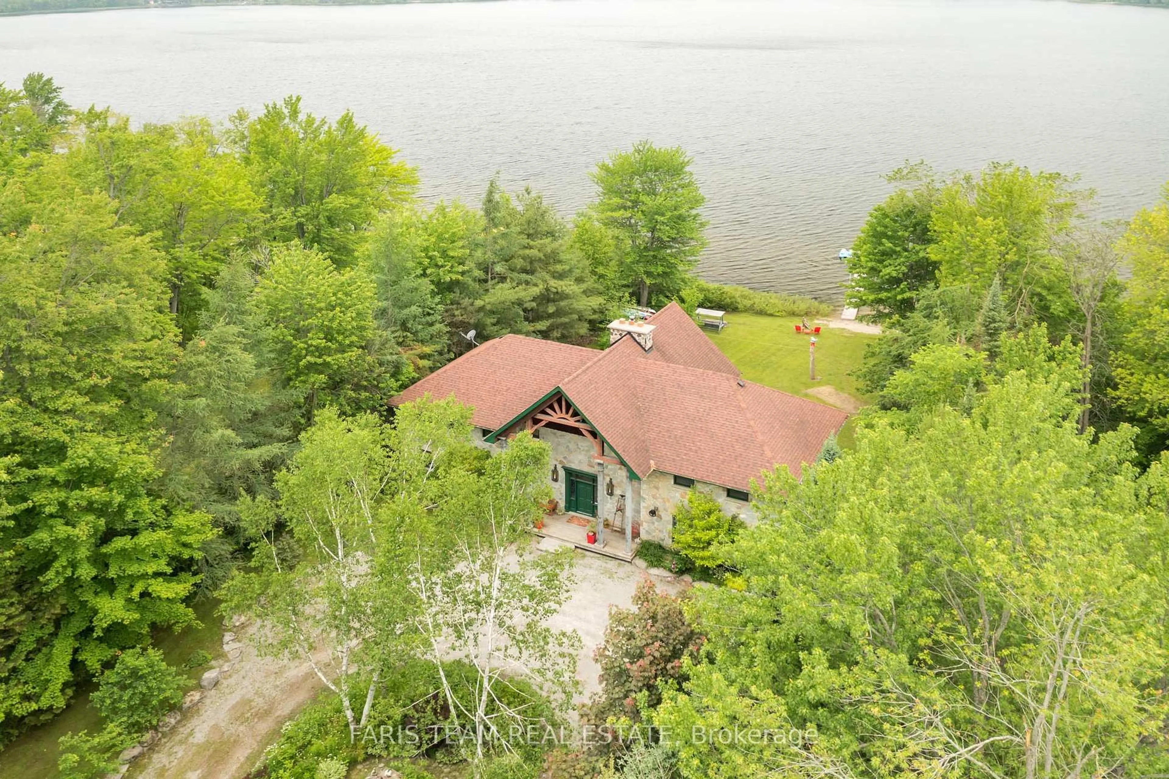 A pic from outside/outdoor area/front of a property/back of a property/a pic from drone, water/lake/river/ocean view for 241 Monck Rd, Kawartha Lakes Ontario L0K 4W0