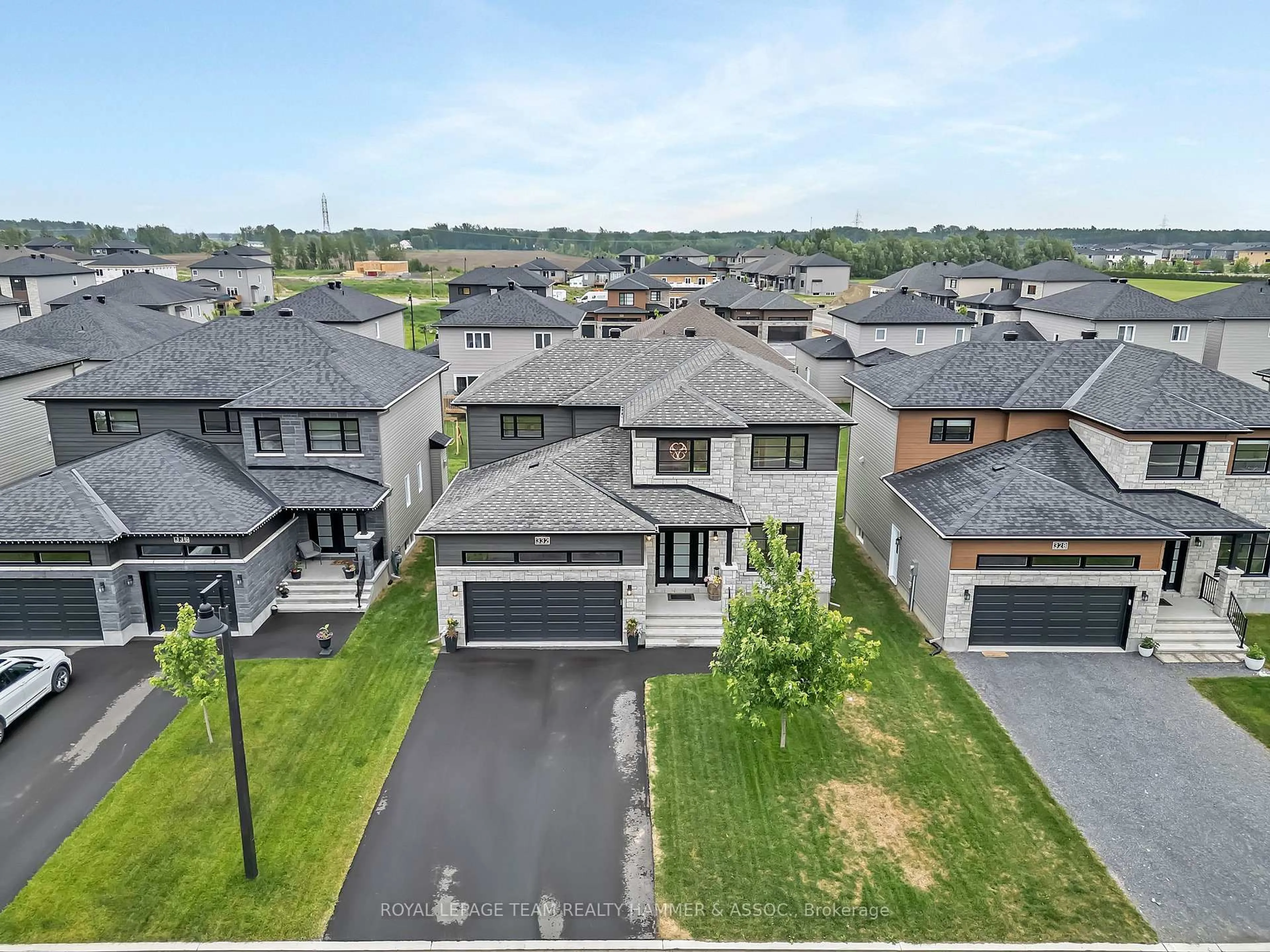 A pic from outside/outdoor area/front of a property/back of a property/a pic from drone, street for 332 Moonlight Dr, Russell Ontario K4R 0L1