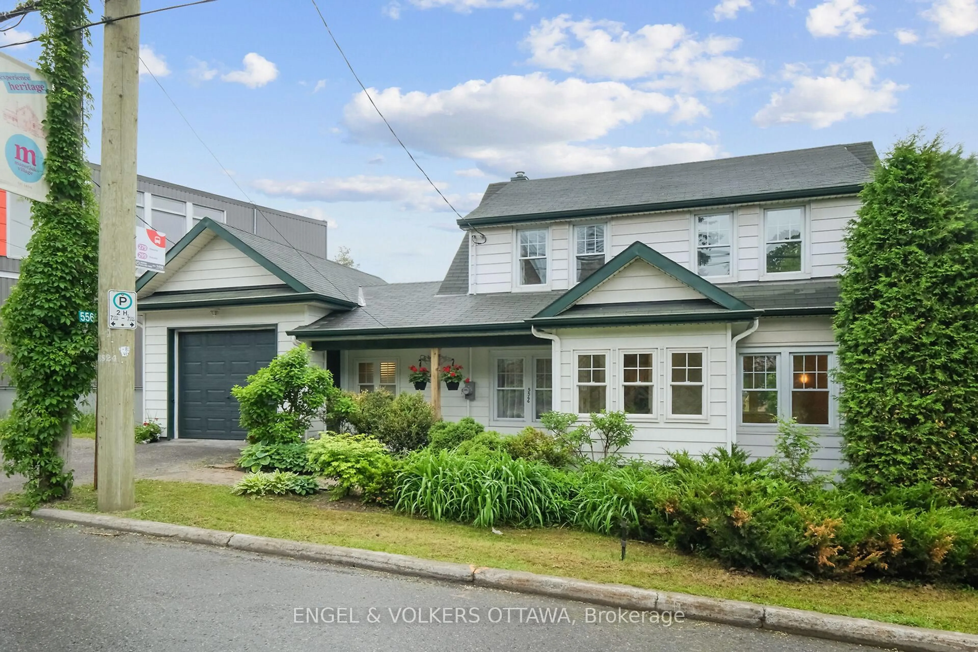 A pic from outside/outdoor area/front of a property/back of a property/a pic from drone, street for 5566 Main St, Manotick Ontario K4M 1A3
