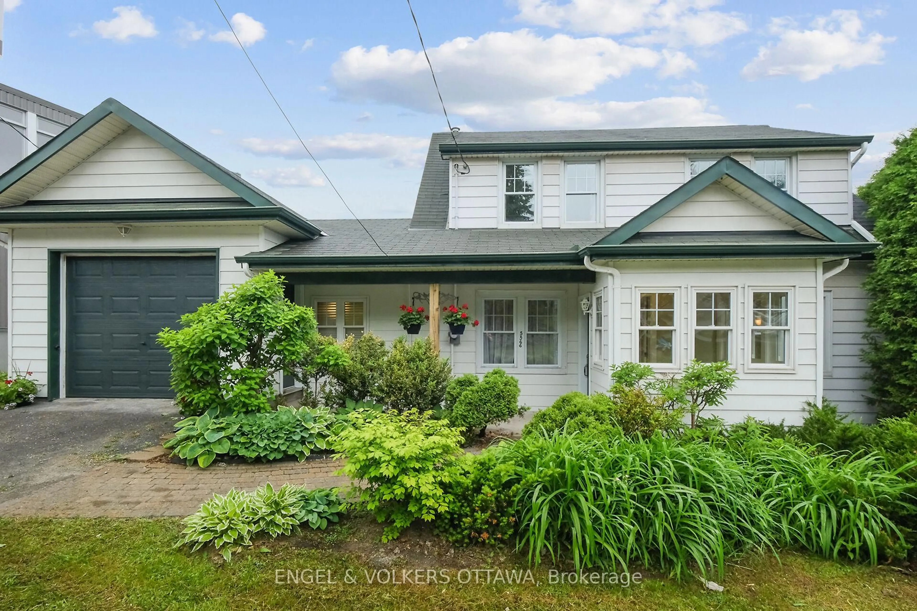 A pic from outside/outdoor area/front of a property/back of a property/a pic from drone, street for 5566 Main St, Manotick Ontario K4M 1A3