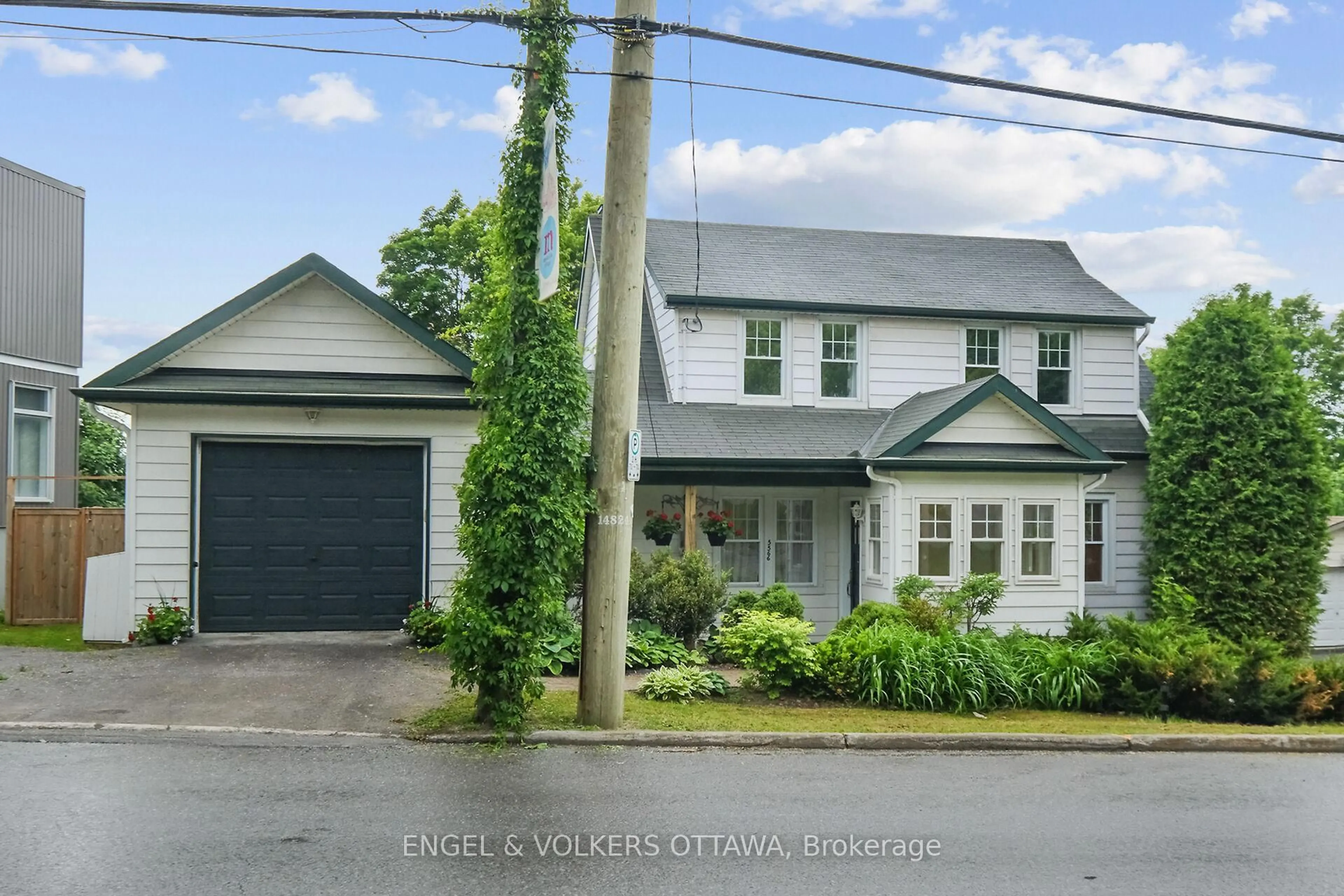 A pic from outside/outdoor area/front of a property/back of a property/a pic from drone, street for 5566 Main St, Manotick Ontario K4M 1A3
