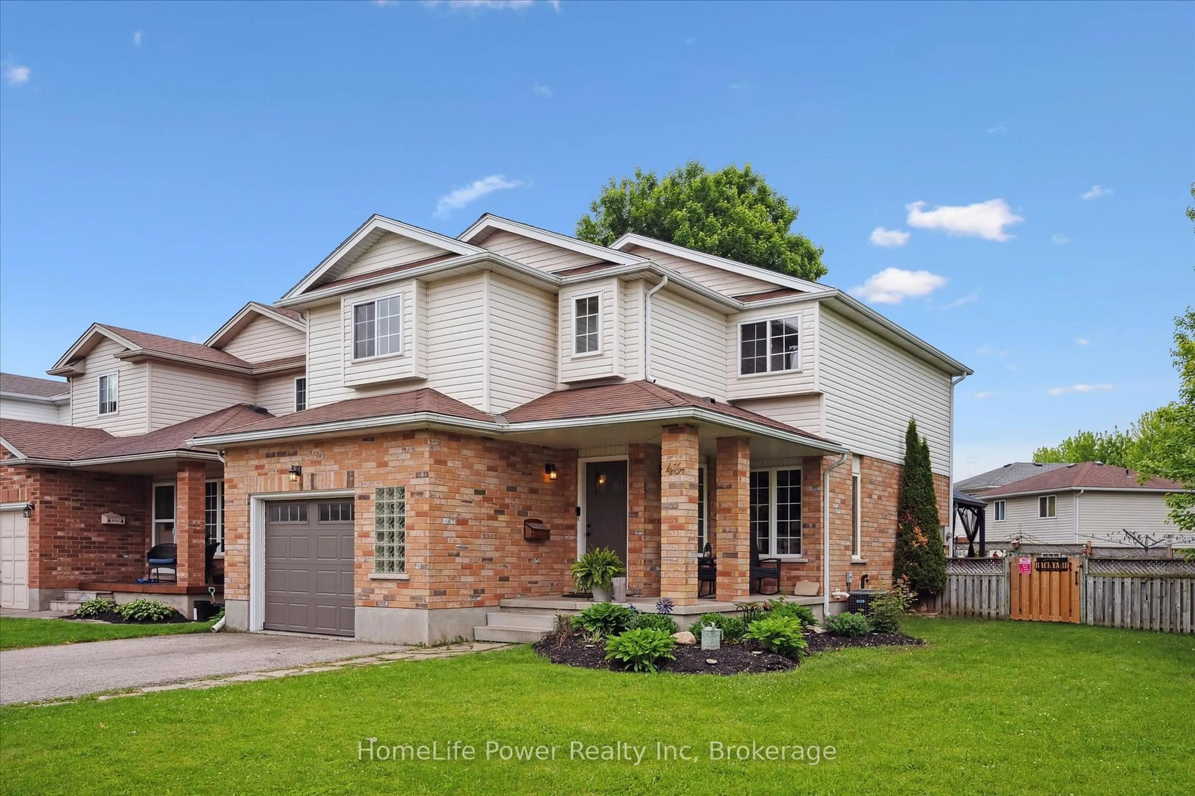 Home with brick exterior material, street for 43 Hill Tr, Guelph Ontario N1E 7C5