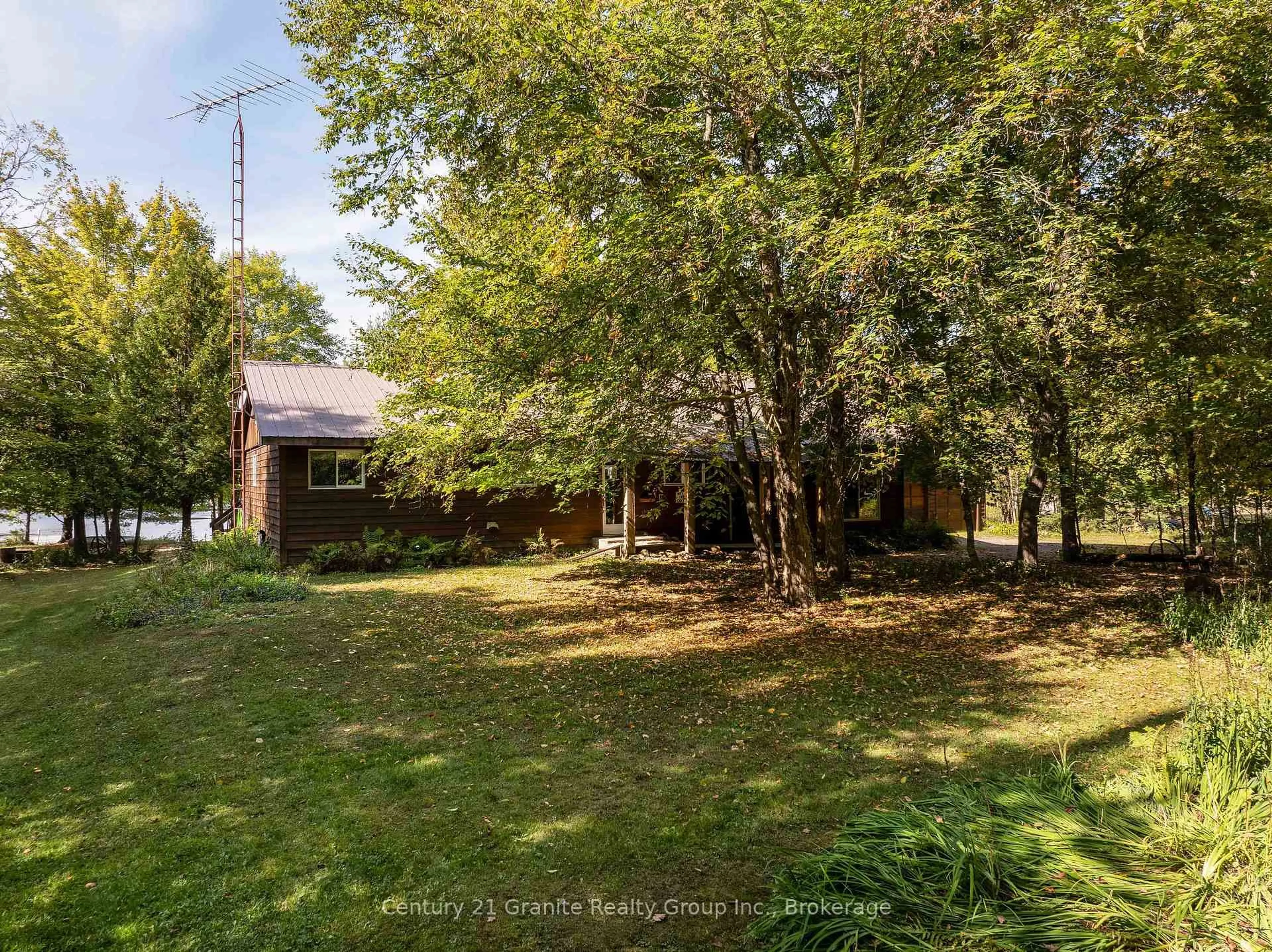 A pic from outside/outdoor area/front of a property/back of a property/a pic from drone, unknown for 1054 The Narrows Tr, Minden Hills Ontario K0M 2K0