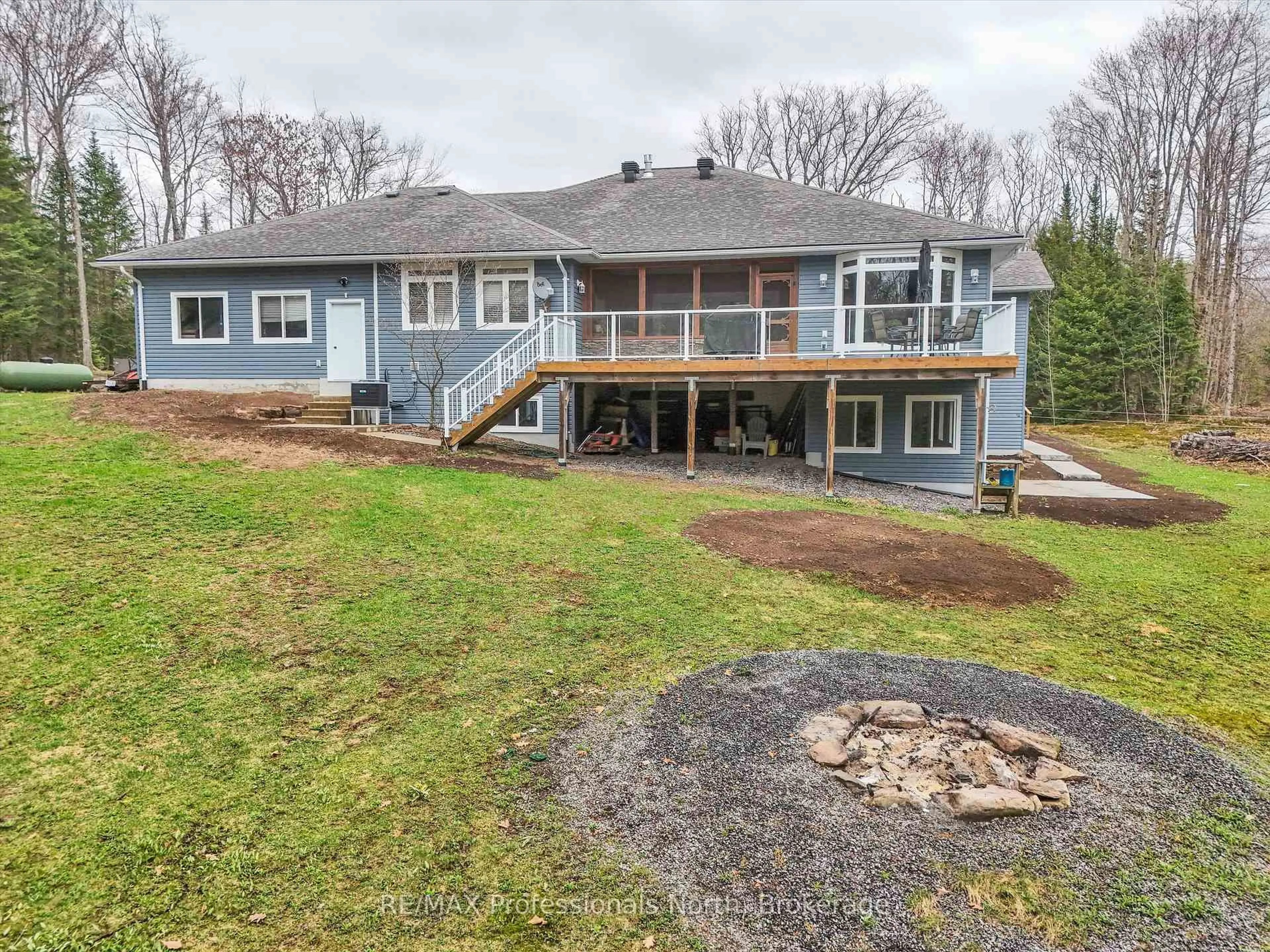A pic from outside/outdoor area/front of a property/back of a property/a pic from drone, water/lake/river/ocean view for 93 Mainhood's Rd, Huntsville Ontario P0B 1M0