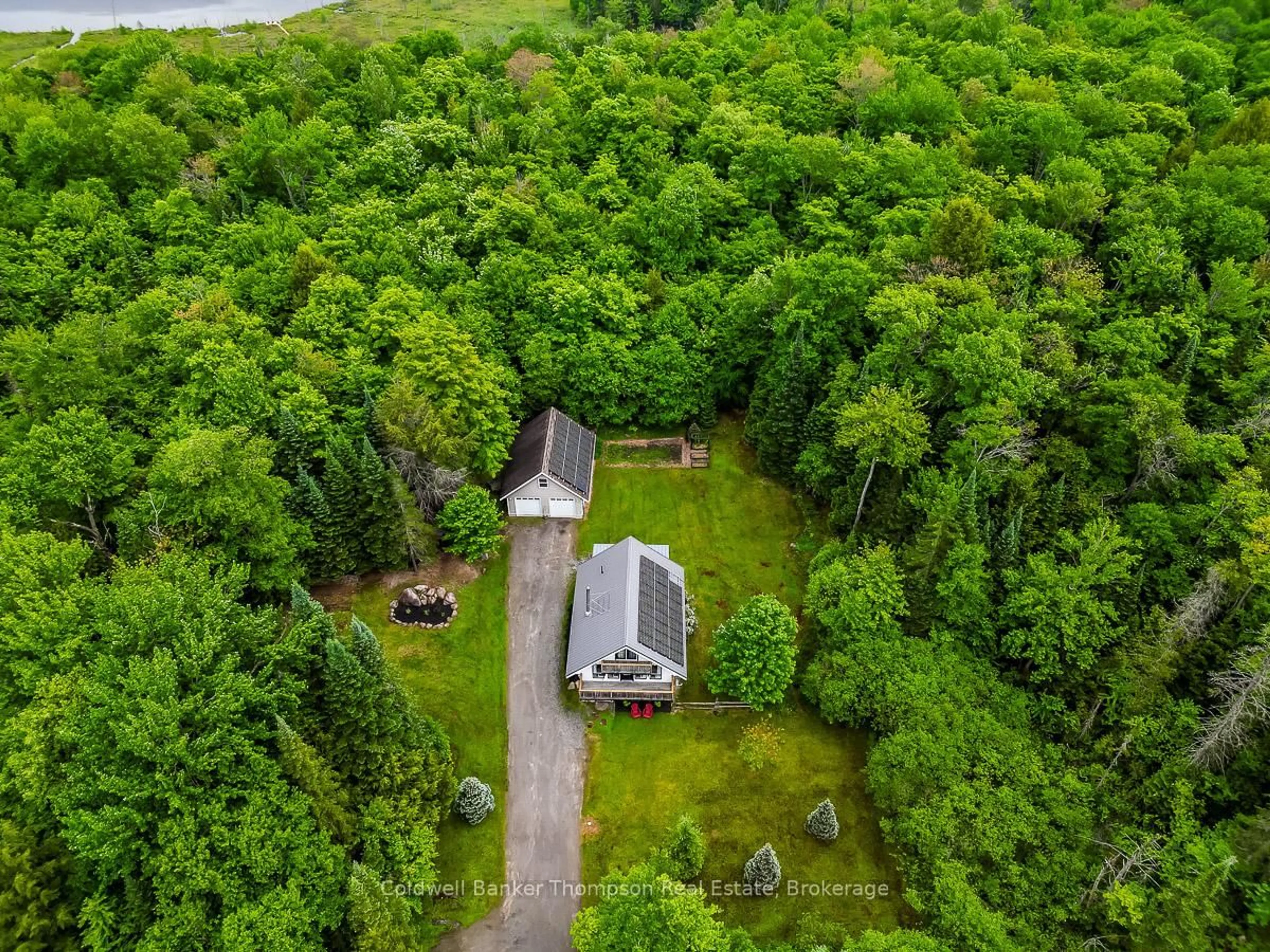 A pic from outside/outdoor area/front of a property/back of a property/a pic from drone, forest/trees view for 579 South Waseosa Lake Rd, Huntsville Ontario P1H 2N5