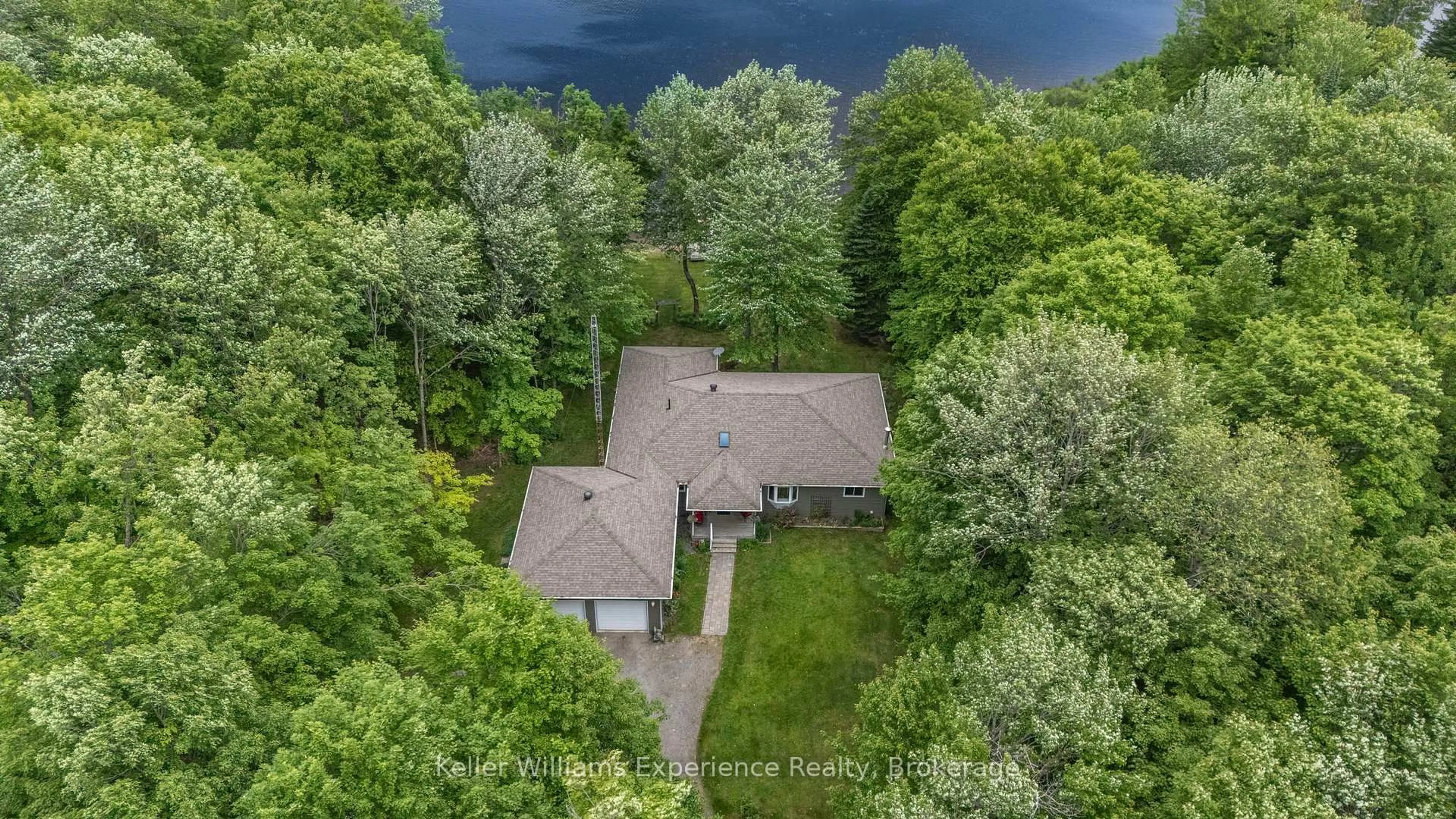 A pic from outside/outdoor area/front of a property/back of a property/a pic from drone, water/lake/river/ocean view for 1248 Healey Lk Rd, Bracebridge Ontario P1L 1X3