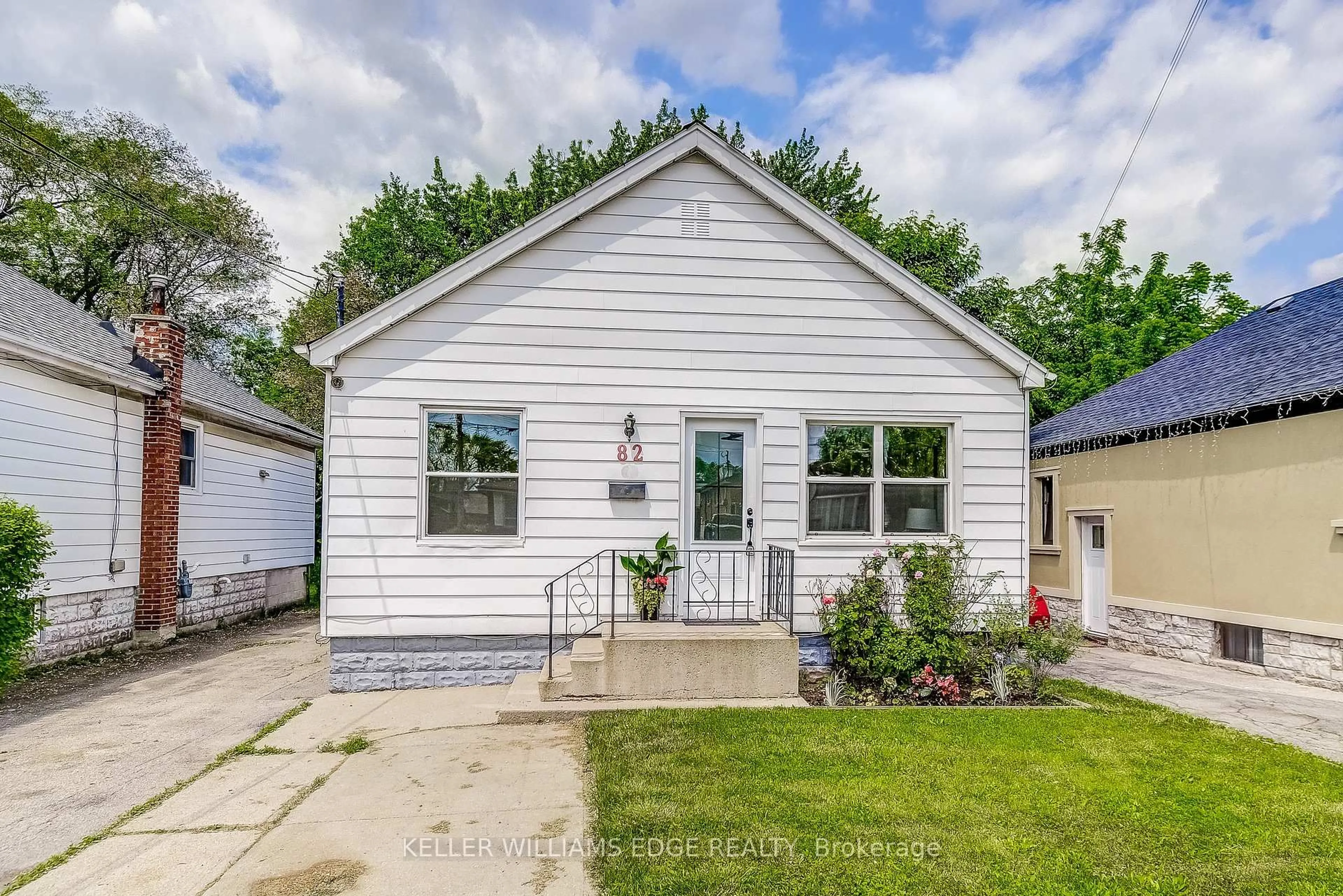 Home with vinyl exterior material, street for 82 West 1st St, Hamilton Ontario L9C 3C4