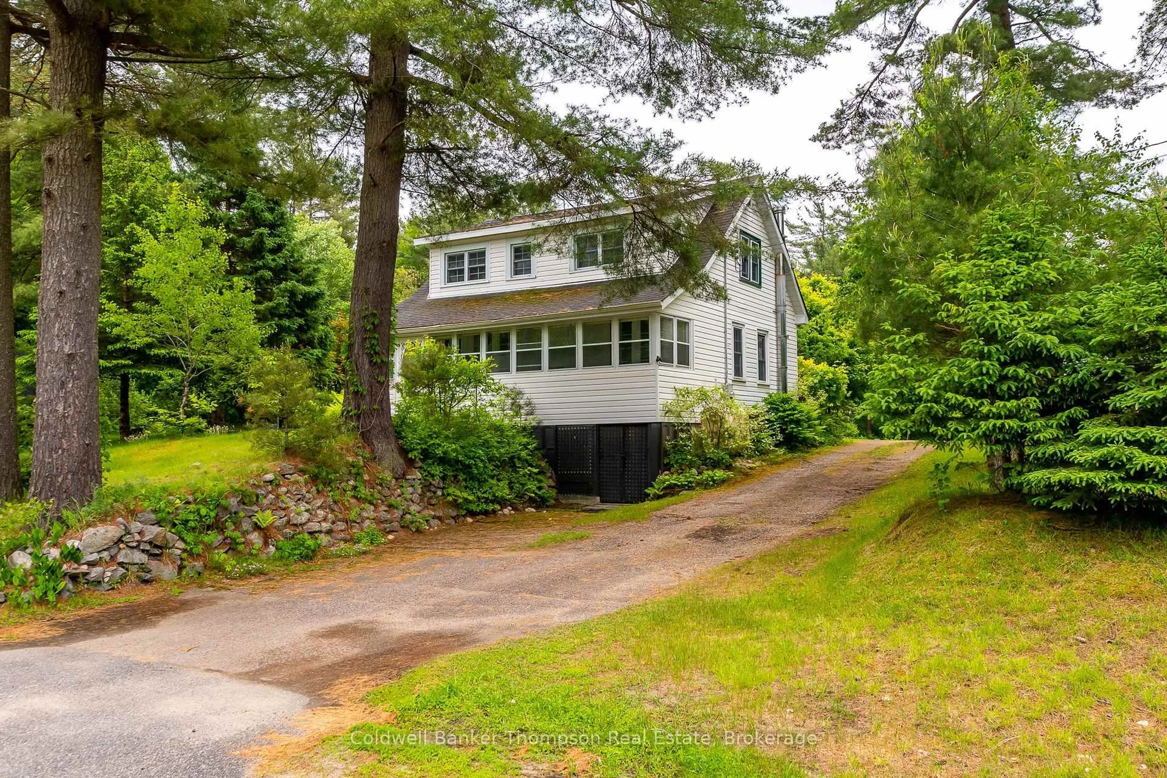 A pic from outside/outdoor area/front of a property/back of a property/a pic from drone, street for 623 141 Highway, Huntsville Ontario P0B 1M0