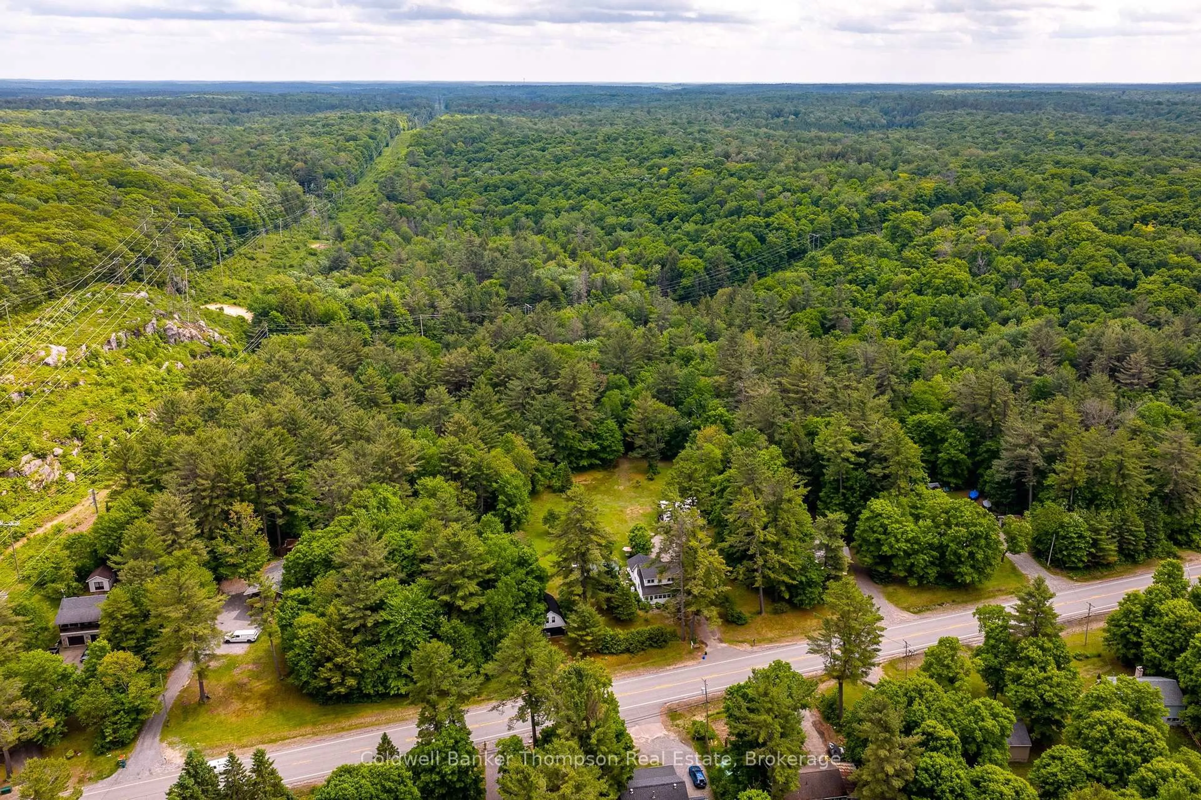 A pic from outside/outdoor area/front of a property/back of a property/a pic from drone, forest/trees view for 623 141 Highway, Huntsville Ontario P0B 1M0