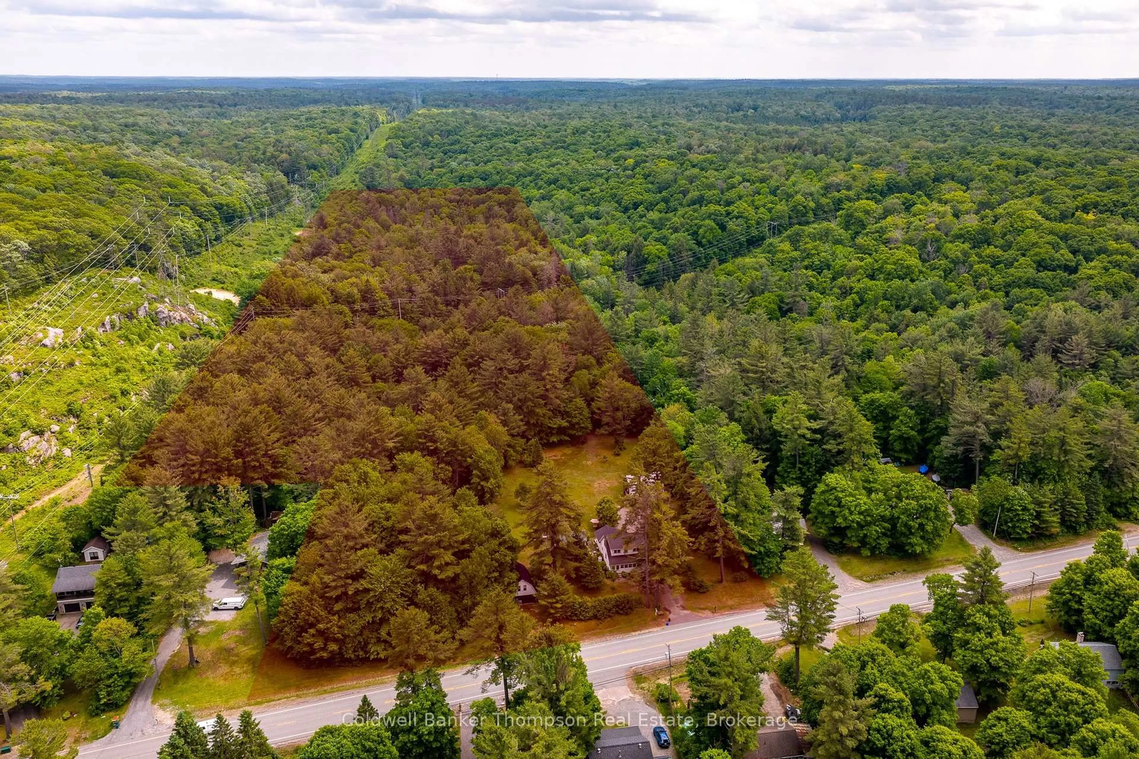 A pic from outside/outdoor area/front of a property/back of a property/a pic from drone, forest/trees view for 623 141 Highway, Huntsville Ontario P0B 1M0