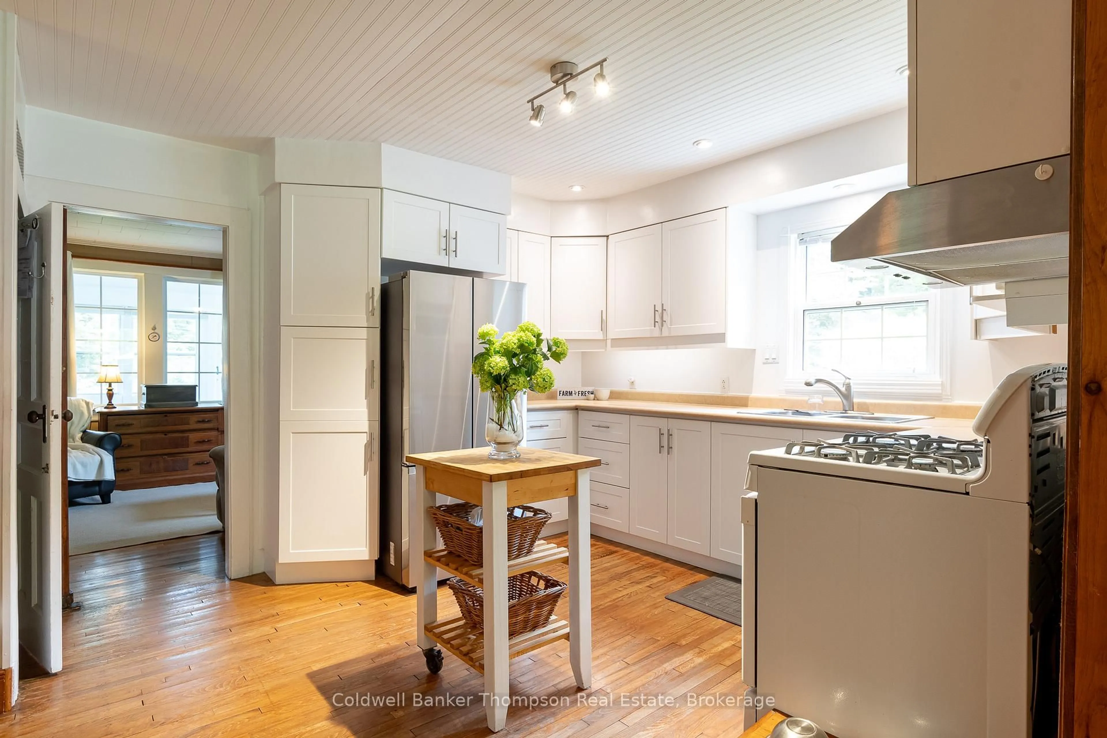 Open concept kitchen, wood/laminate floor for 623 141 Highway, Huntsville Ontario P0B 1M0