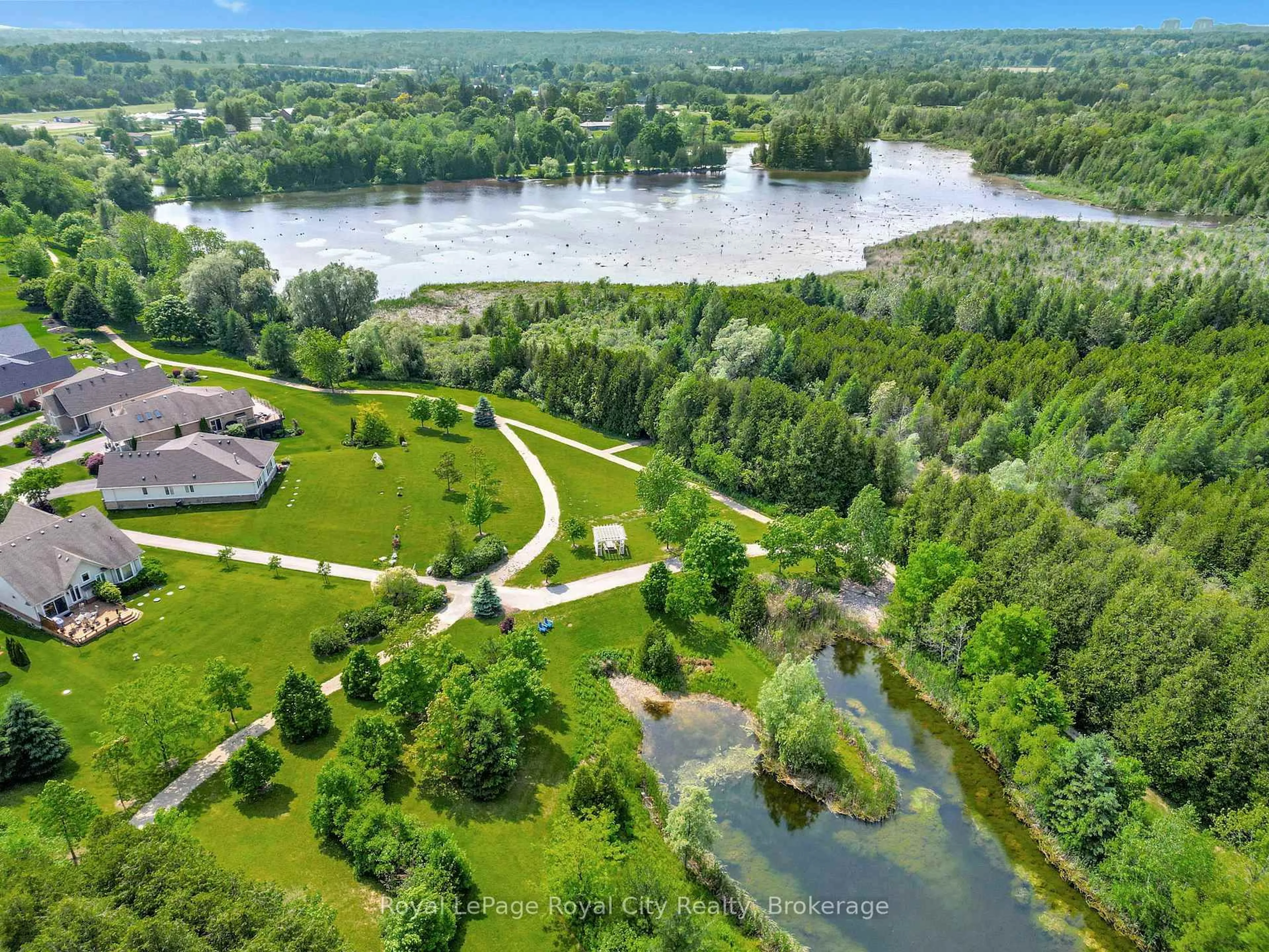 A pic from outside/outdoor area/front of a property/back of a property/a pic from drone, water/lake/river/ocean view for 114 Aberfoyle Mill Cres, Puslinch Ontario N0B 2J0