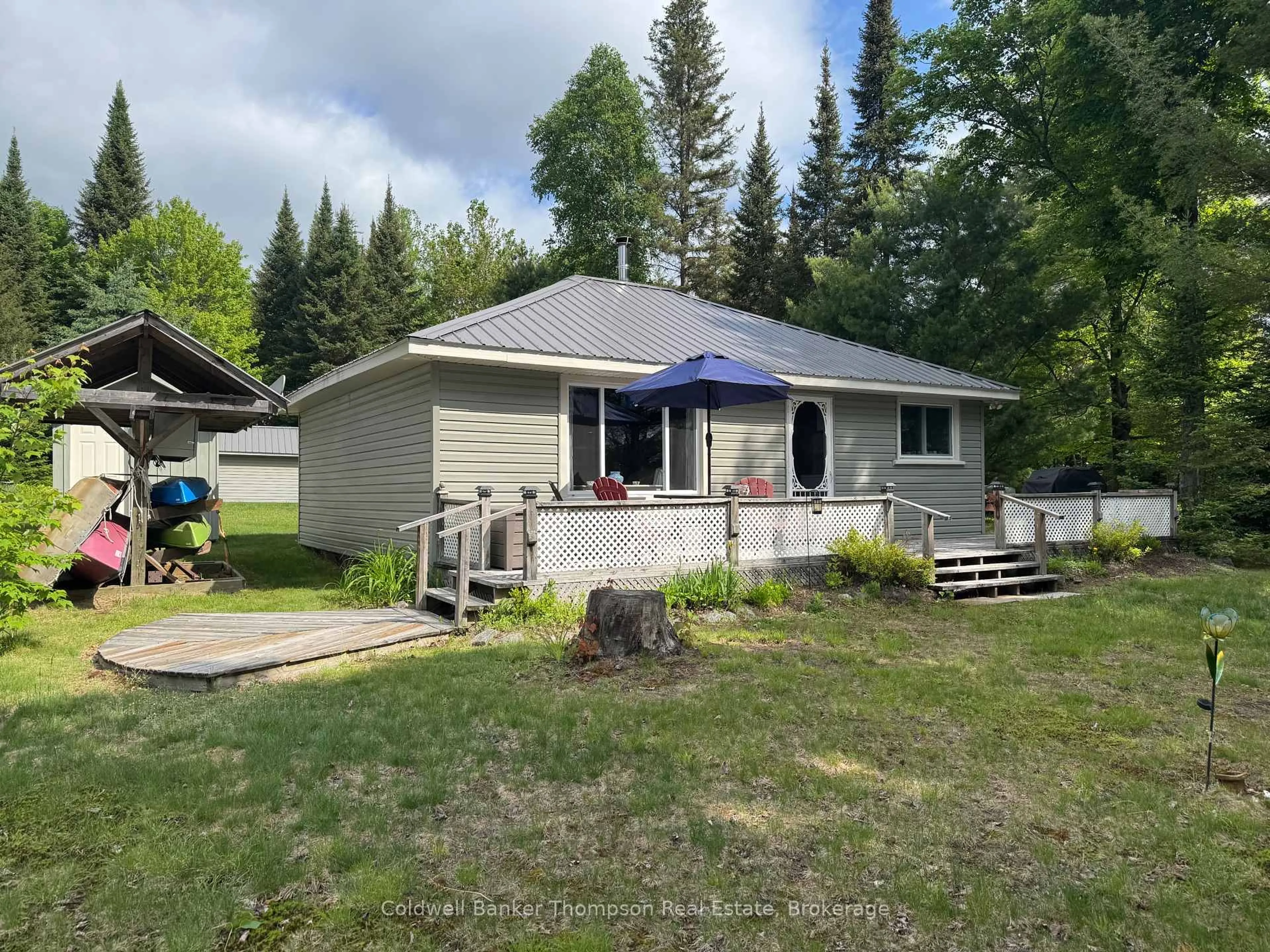 A pic from outside/outdoor area/front of a property/back of a property/a pic from drone, unknown for 105 Pineaire Lane, Perry Ontario P0A 1M0