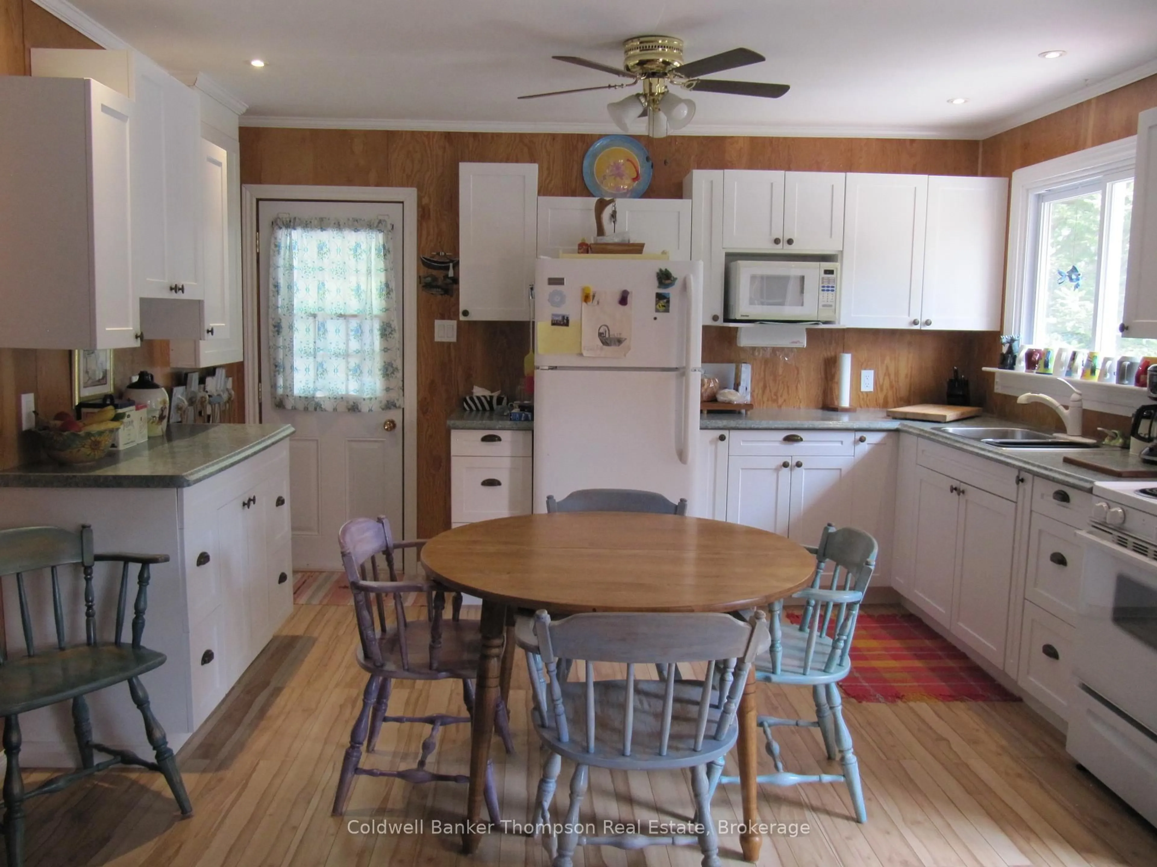 Open concept kitchen, wood/laminate floor for 105 Pineaire Lane, Perry Ontario P0A 1M0