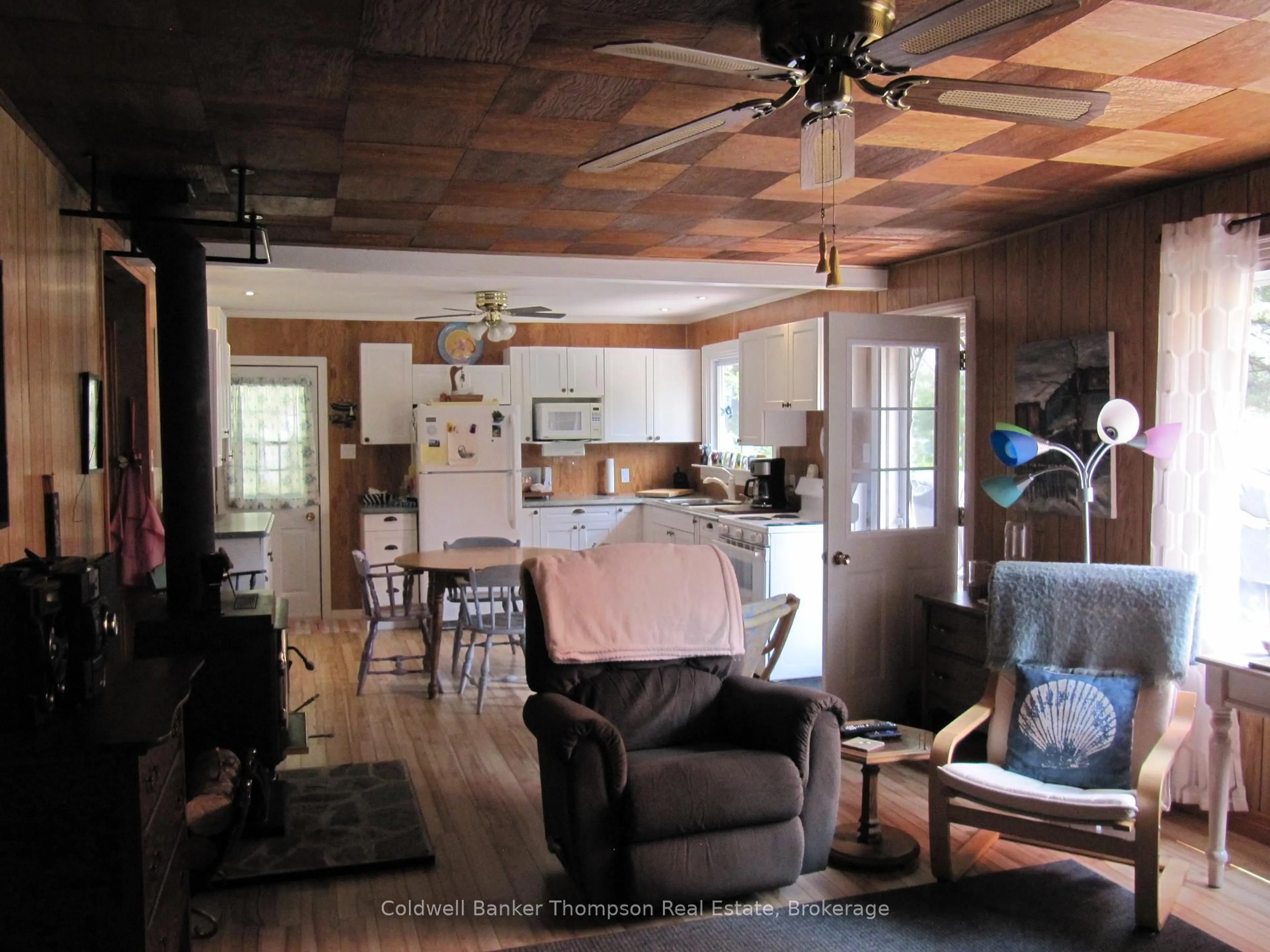 Open concept kitchen, wood/laminate floor for 105 Pineaire Lane, Perry Ontario P0A 1M0