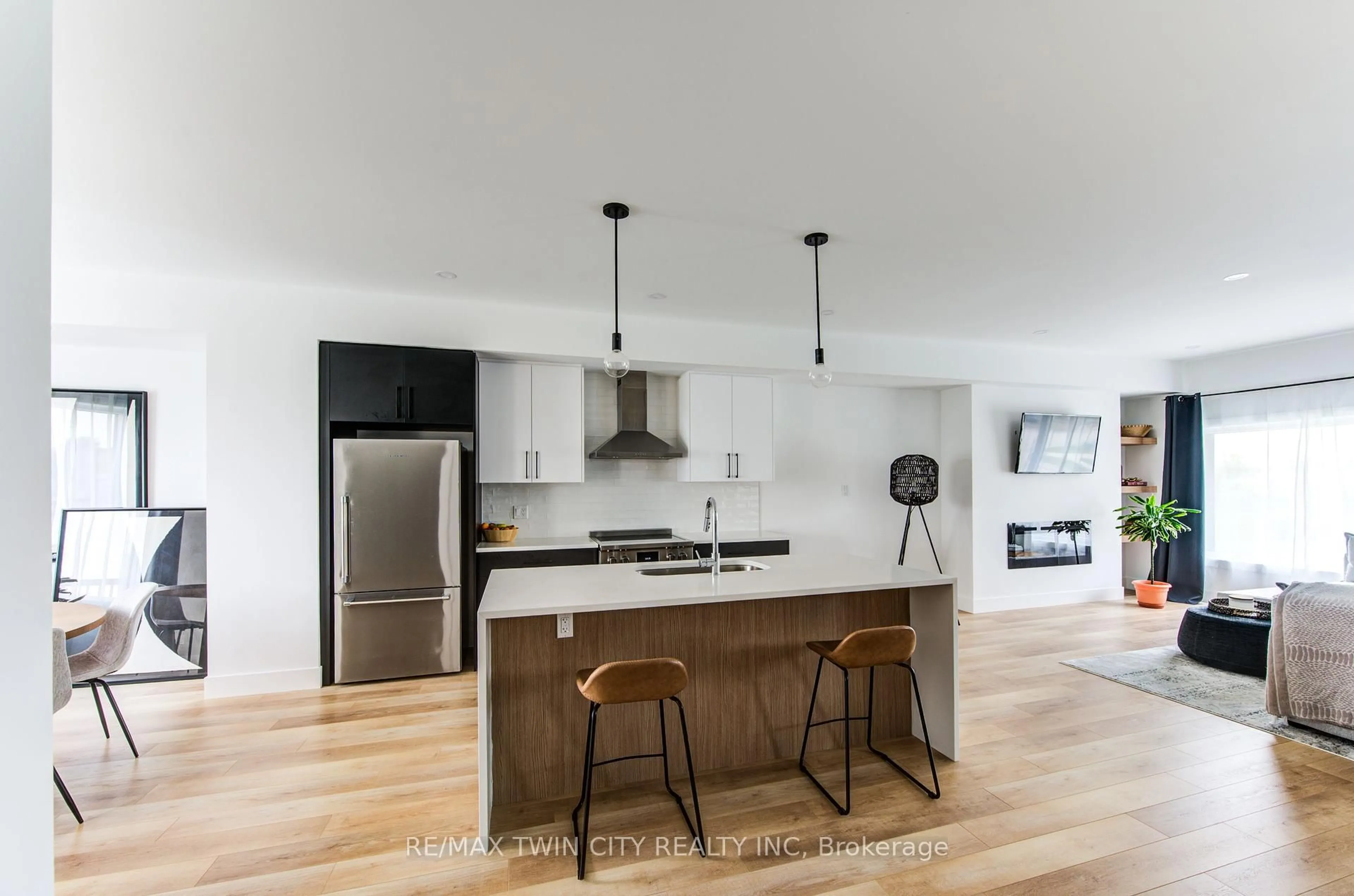 Open concept kitchen, wood/laminate floor for 4222 Lismer Lane #14, London South Ontario N6L 0H7
