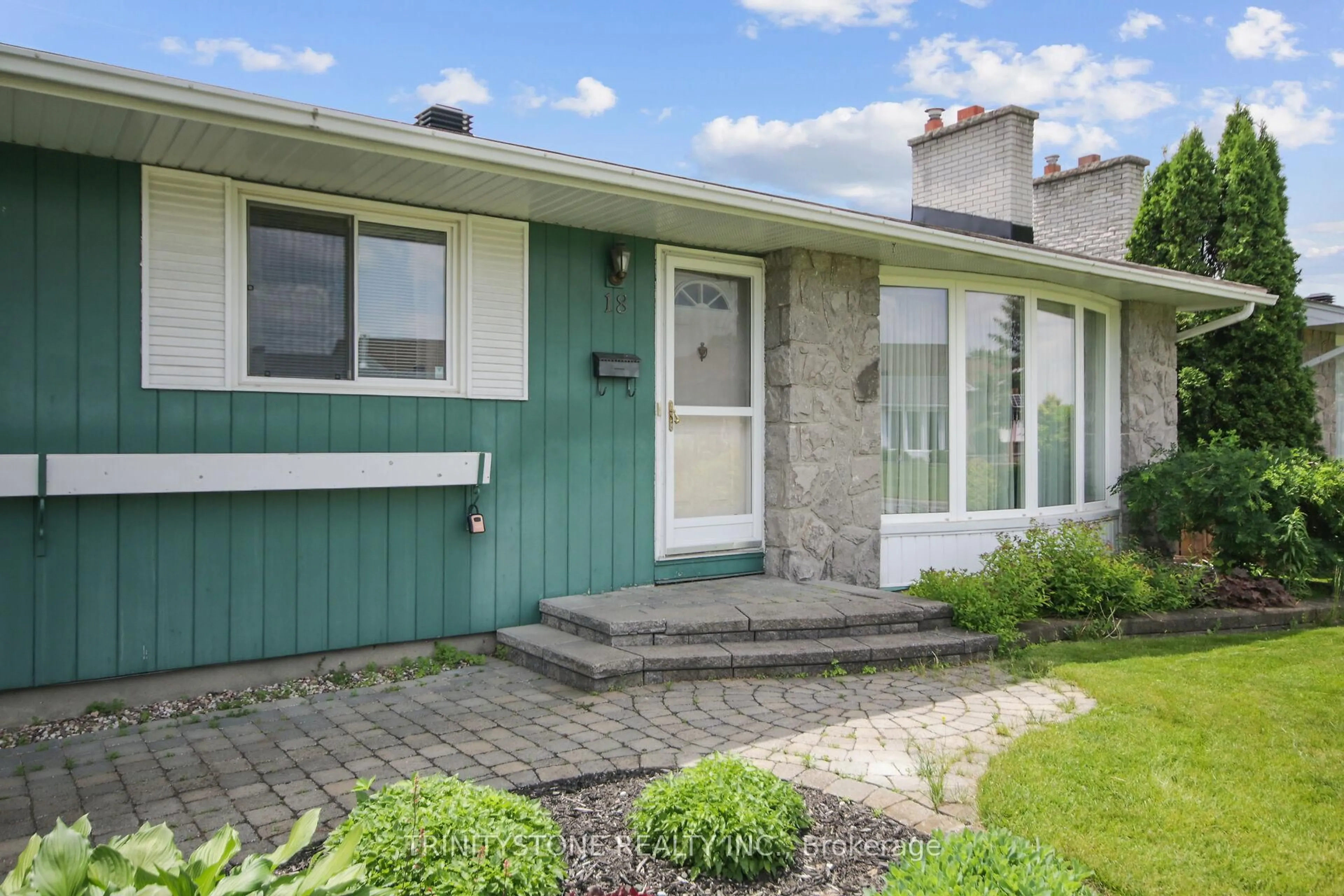 Home with vinyl exterior material, street for 18 charing Rd, Ottawa Ontario K2G 0Z5