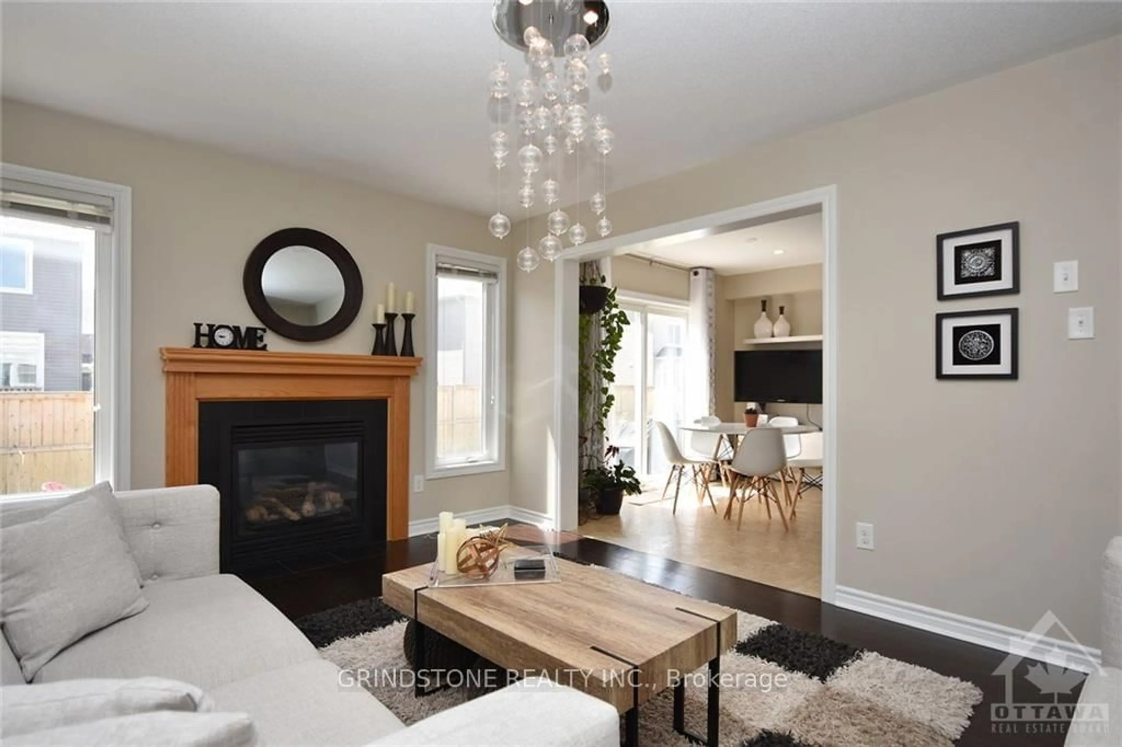 Living room with furniture, wood/laminate floor for 2414 NUTGROVE Ave, Ottawa Ontario K2J 0W9