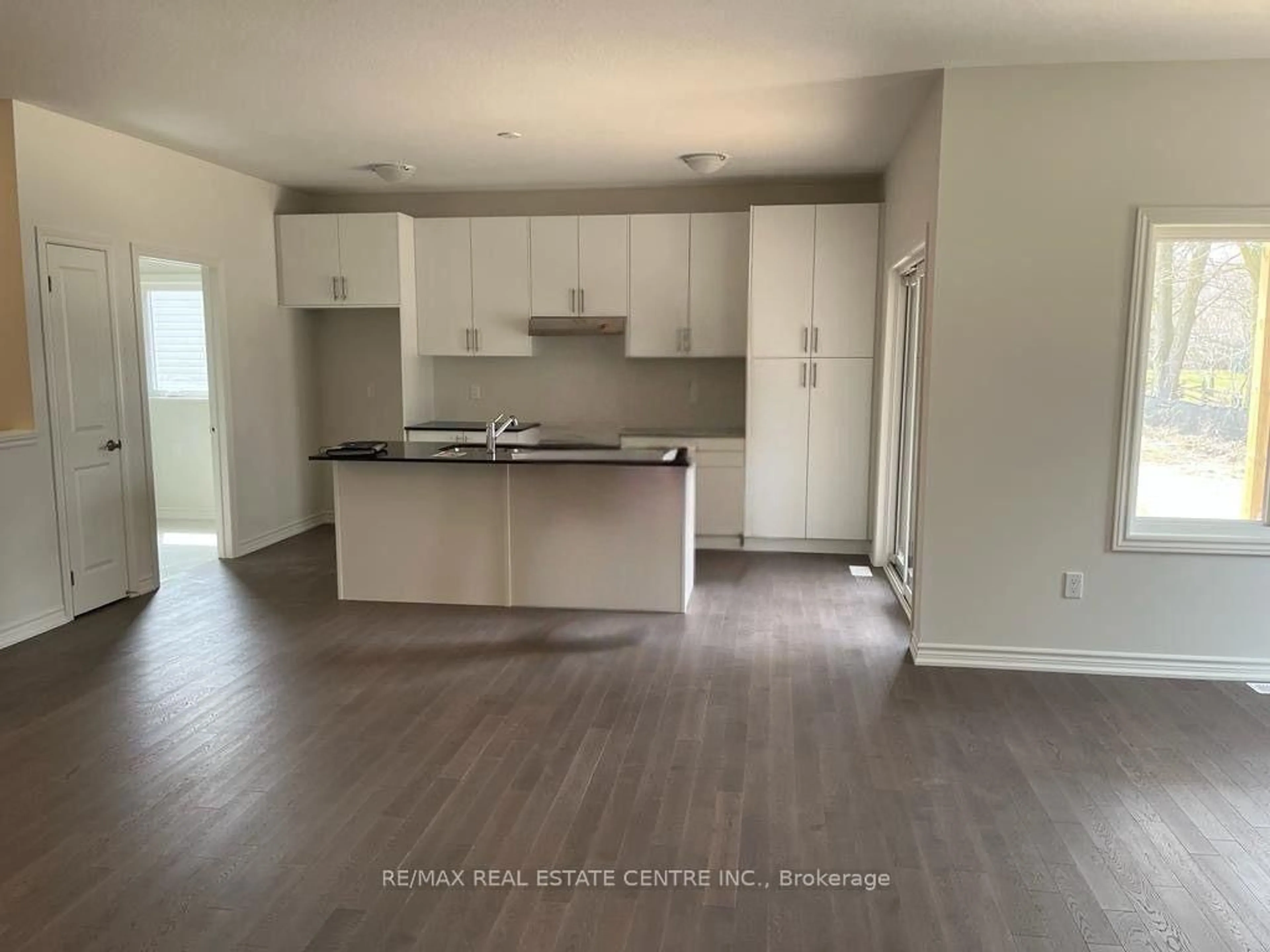 Open concept kitchen, wood/laminate floor for 152 Ellen St, North Perth Ontario N0G 1B0