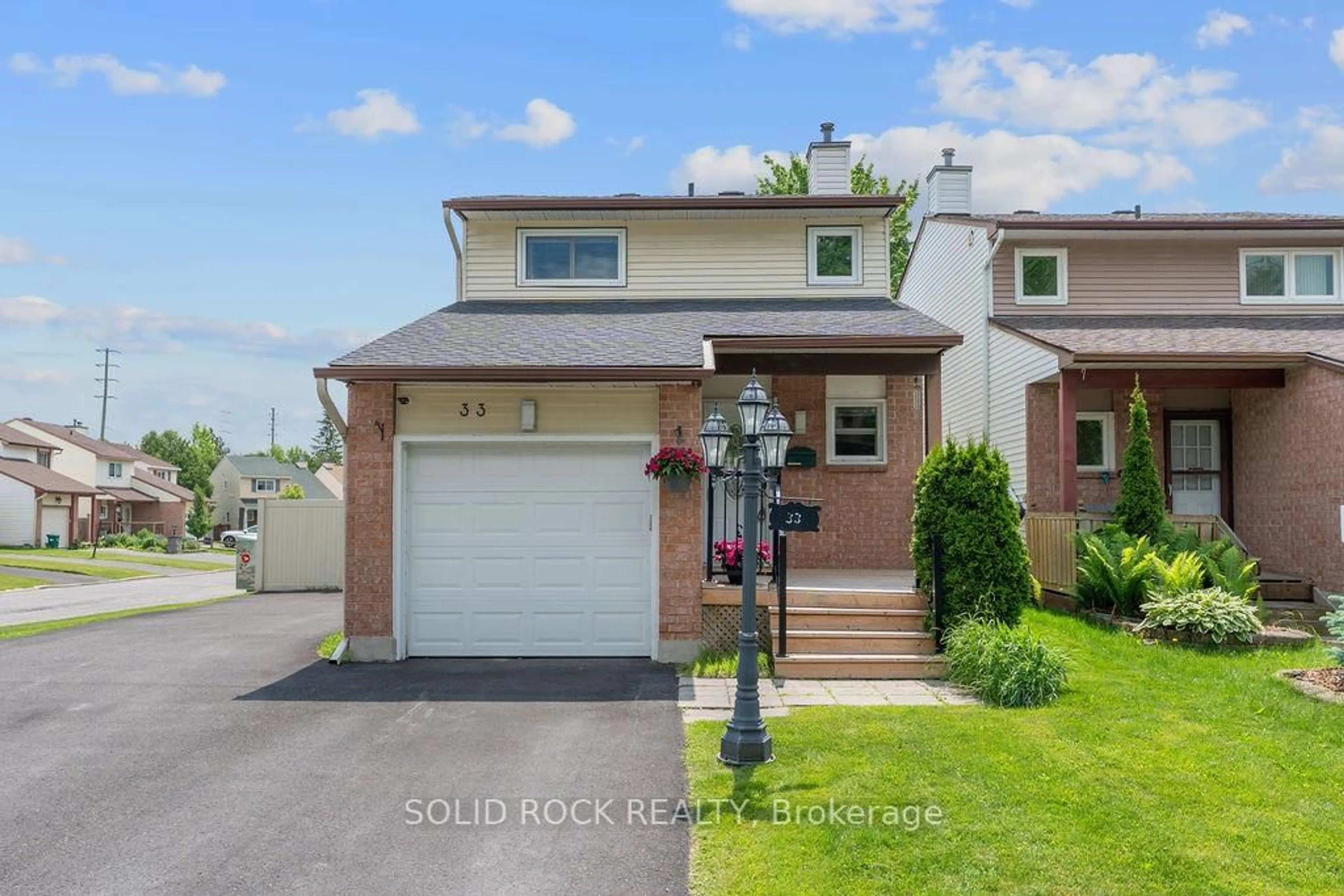 Home with brick exterior material, street for 33 Benlark Rd, Barrhaven Ontario K2J 2L5