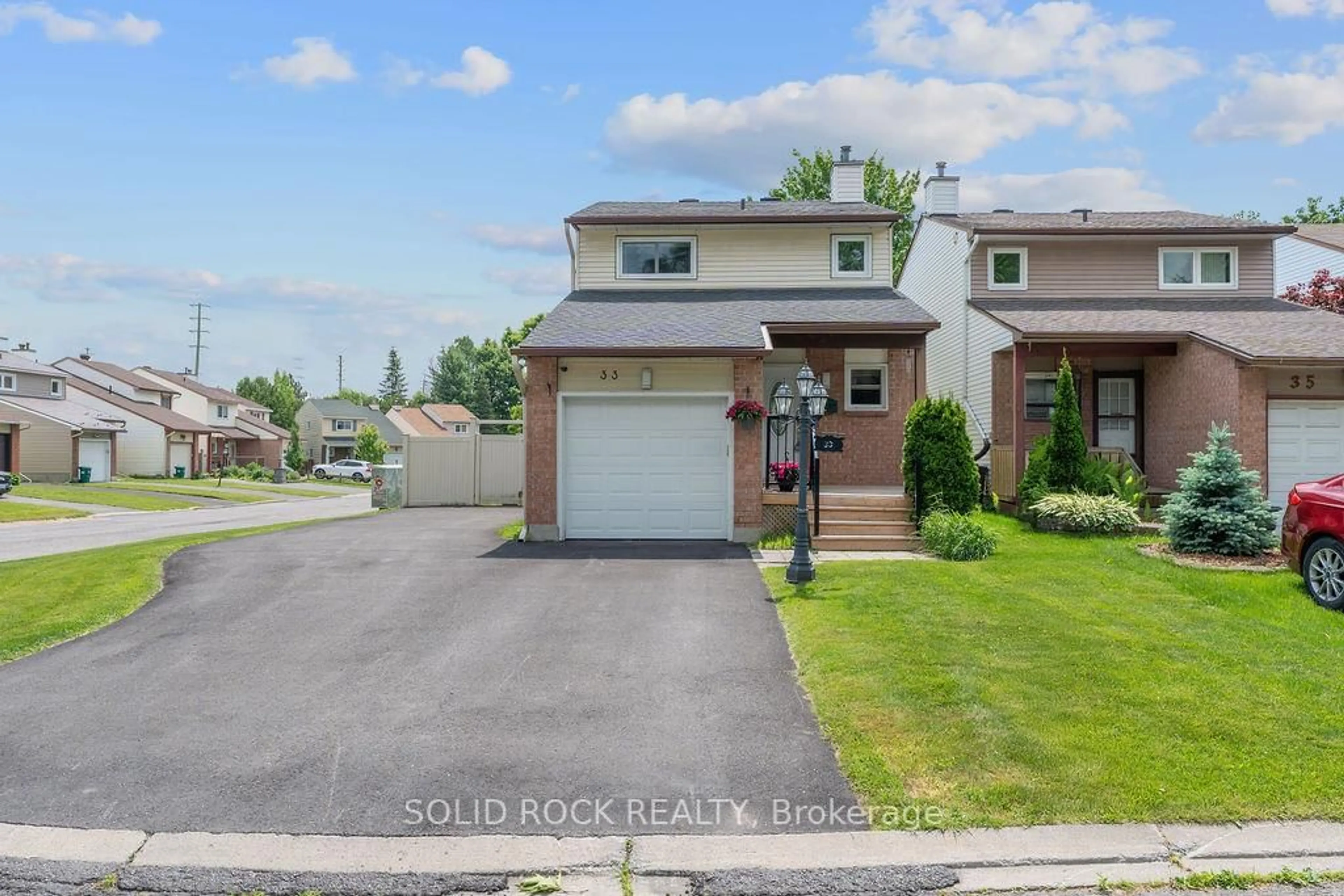 A pic from outside/outdoor area/front of a property/back of a property/a pic from drone, street for 33 Benlark Rd, Barrhaven Ontario K2J 2L5