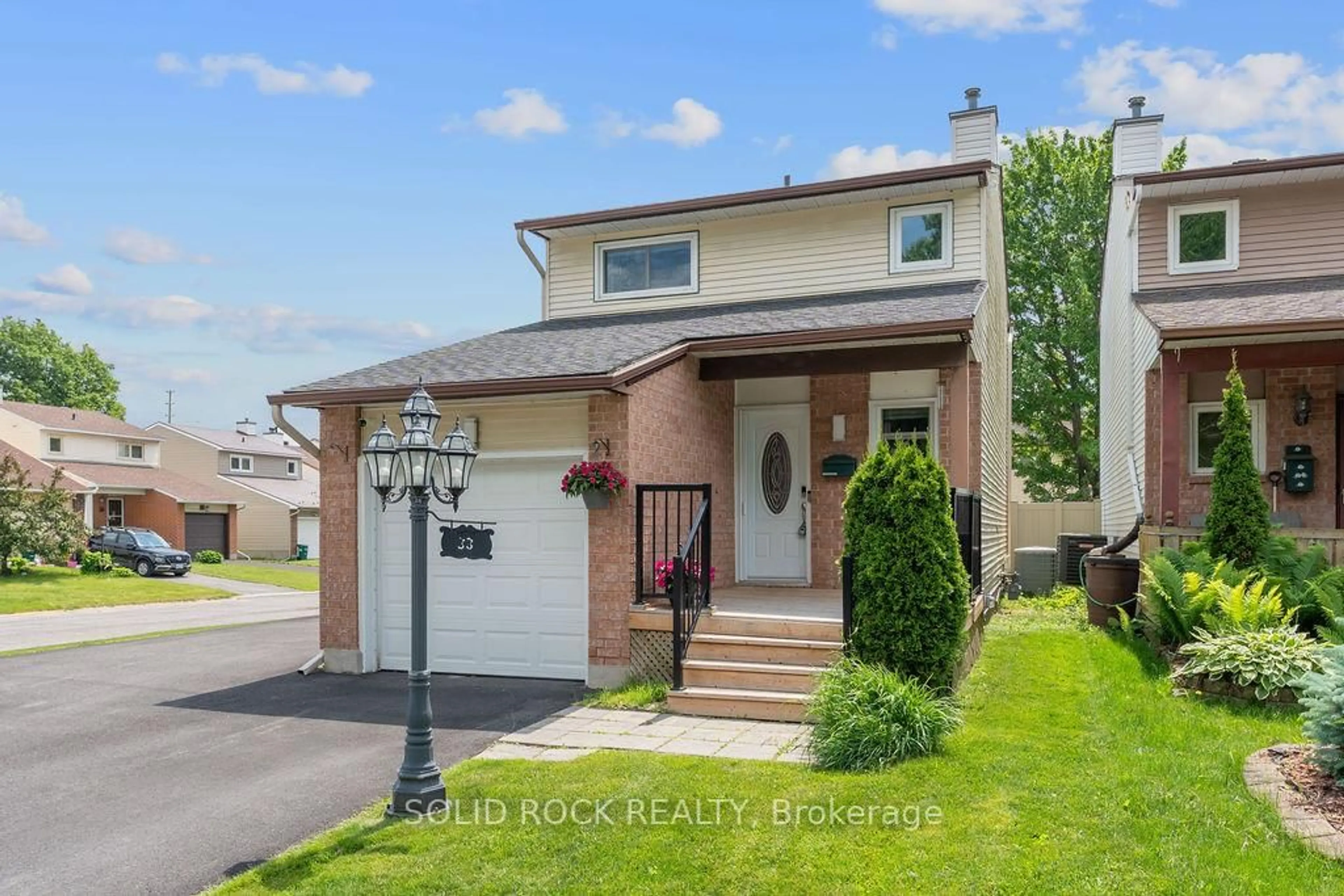 Home with brick exterior material, street for 33 Benlark Rd, Barrhaven Ontario K2J 2L5