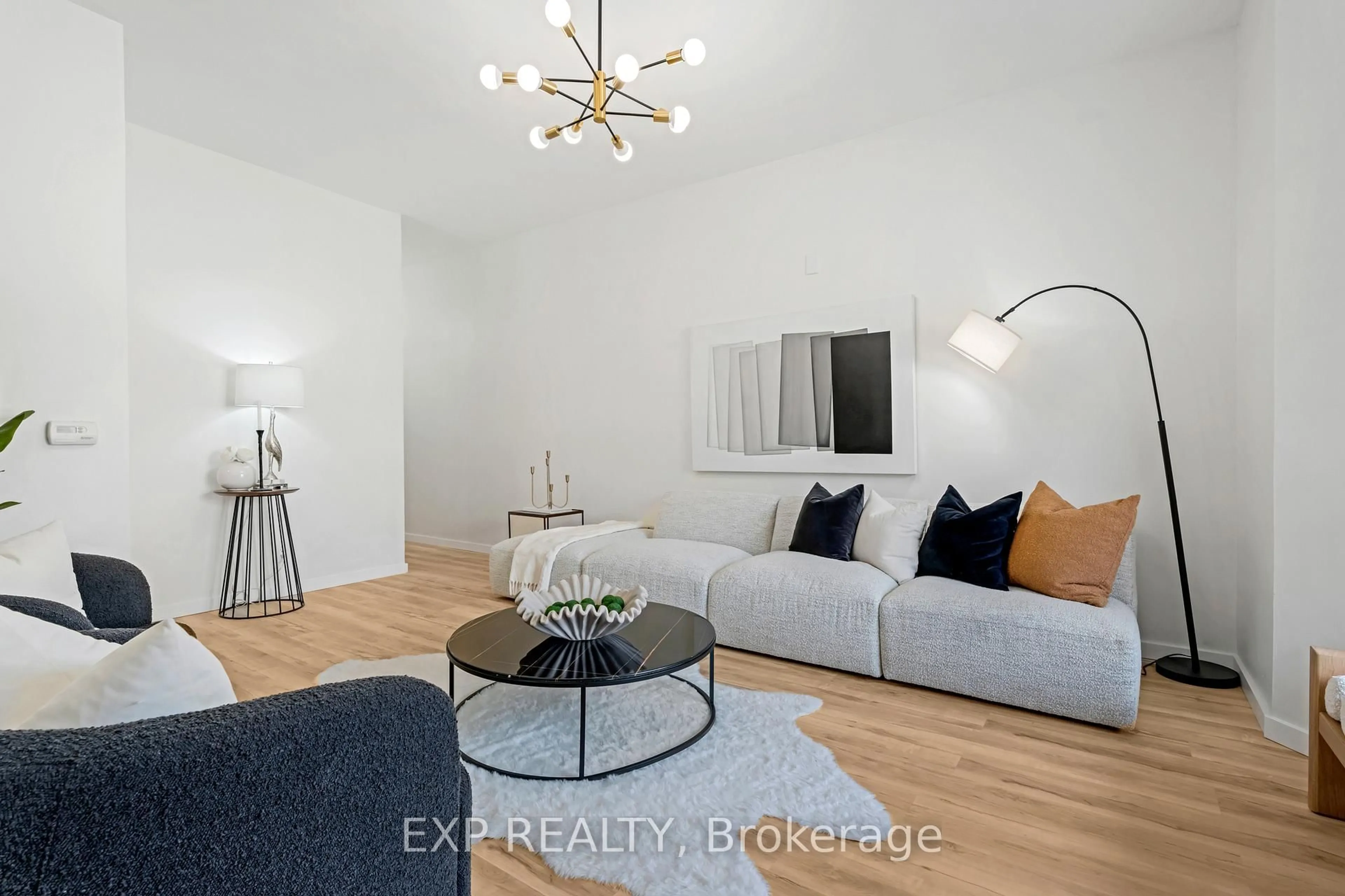 Living room with furniture, wood/laminate floor for 133 Wentworth St, Hamilton Ontario L8L 5V6