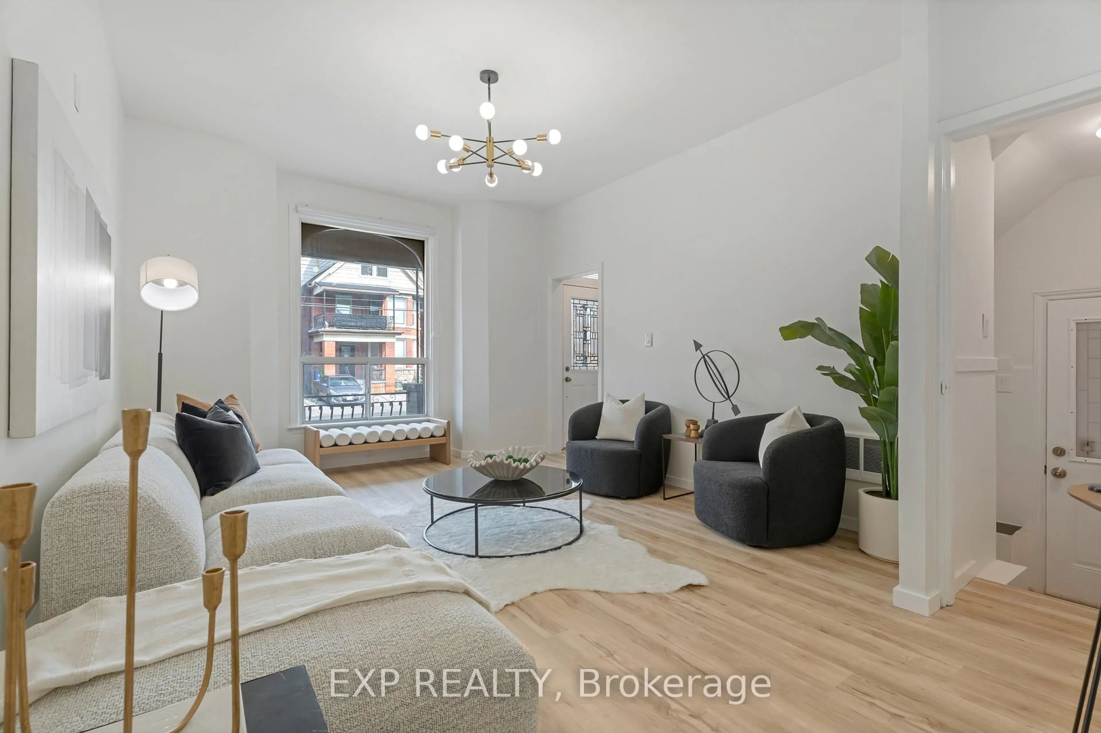 Living room with furniture, wood/laminate floor for 133 Wentworth St, Hamilton Ontario L8L 5V6