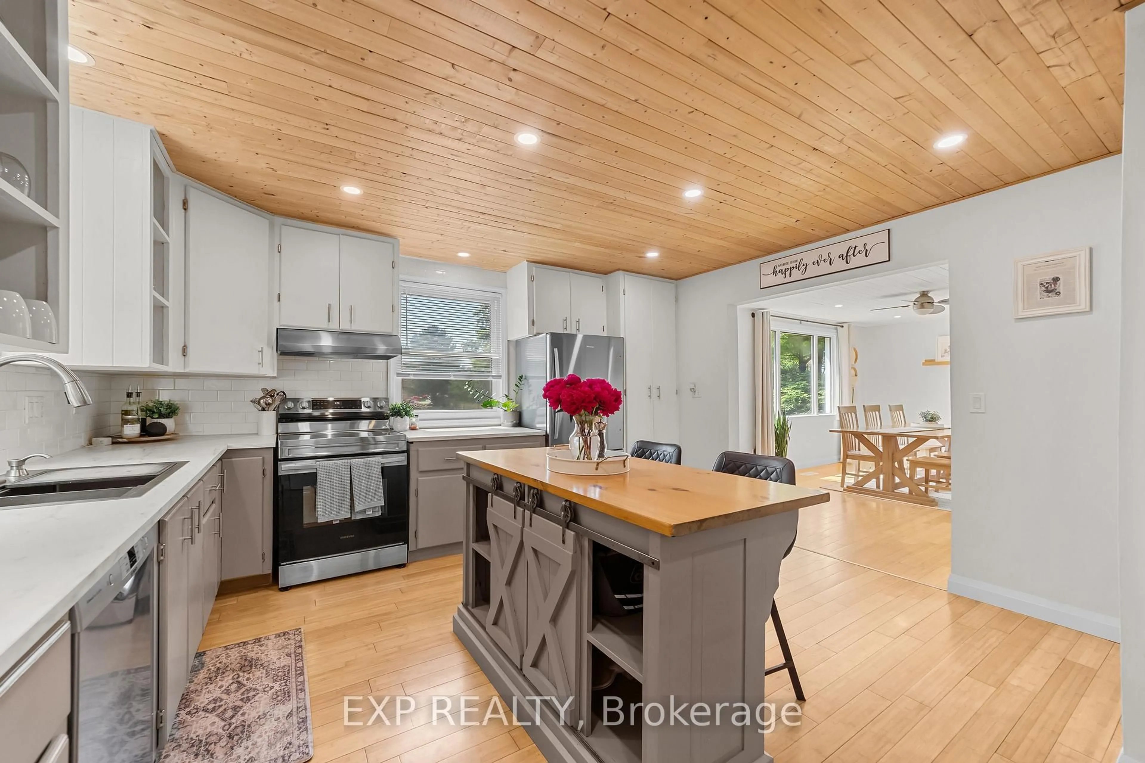 Open concept kitchen, wood/laminate floor for 33202 Back St, Dutton/Dunwich Ontario N0L 1P0