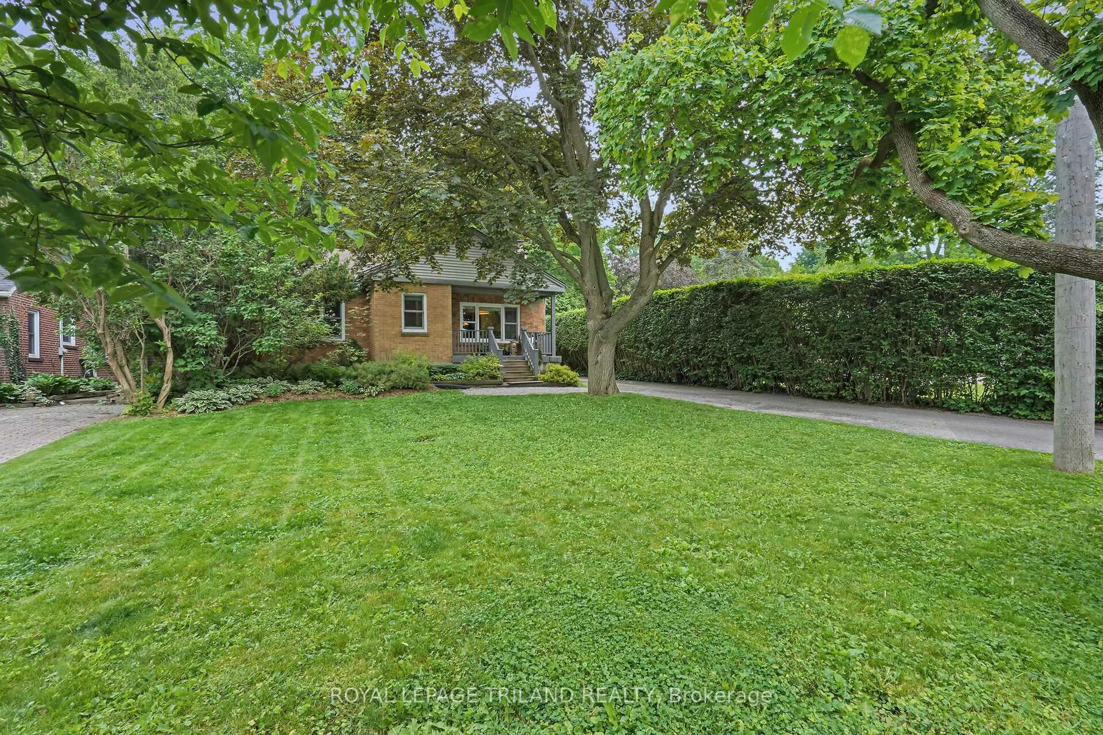 A pic from outside/outdoor area/front of a property/back of a property/a pic from drone, street for 579 Regent St, London East Ontario N5Y 4H7