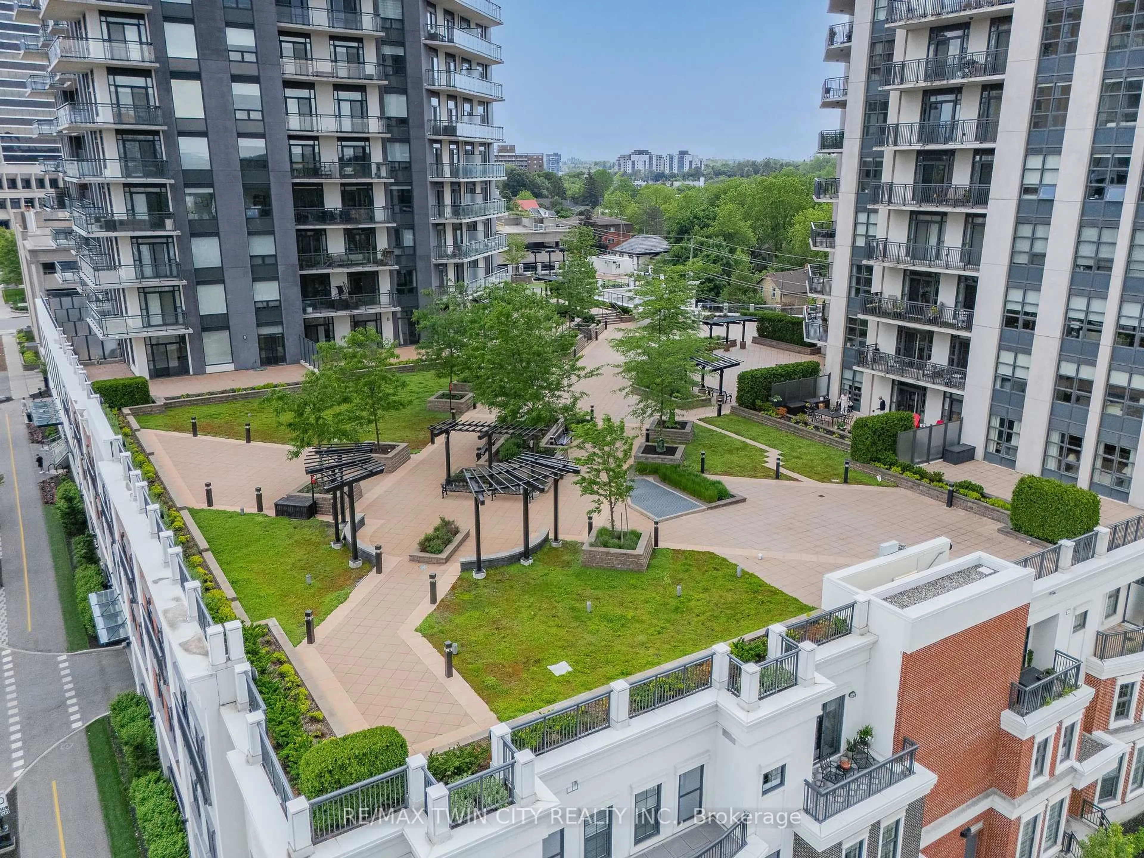 A pic from outside/outdoor area/front of a property/back of a property/a pic from drone, city buildings view from balcony for 155 Caroline St #1411, Waterloo Ontario N2L 0J8