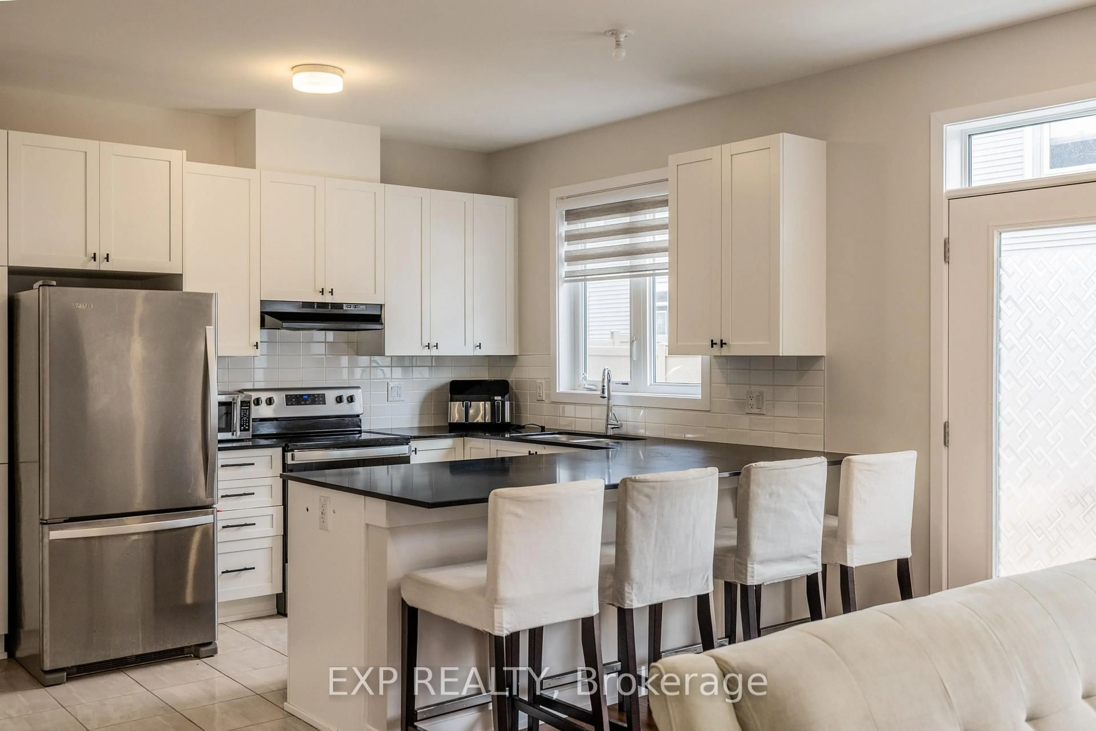 Open concept kitchen, ceramic/tile floor for 307 Canadensis Lane, Ottawa Ontario K2J 6X8