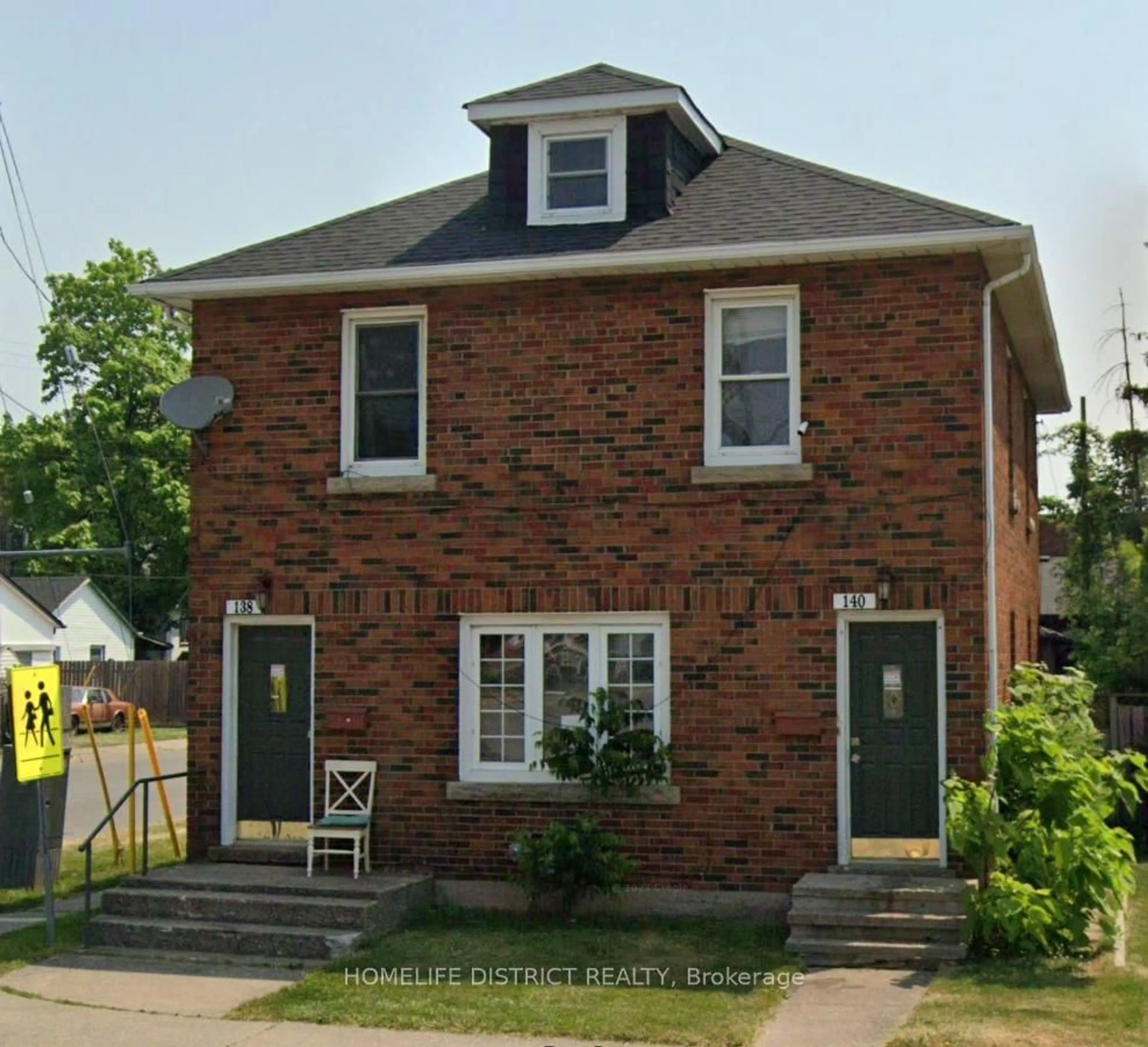 Home with brick exterior material, street for 138-140 Crowland Ave, Welland Ontario L3B 1X3