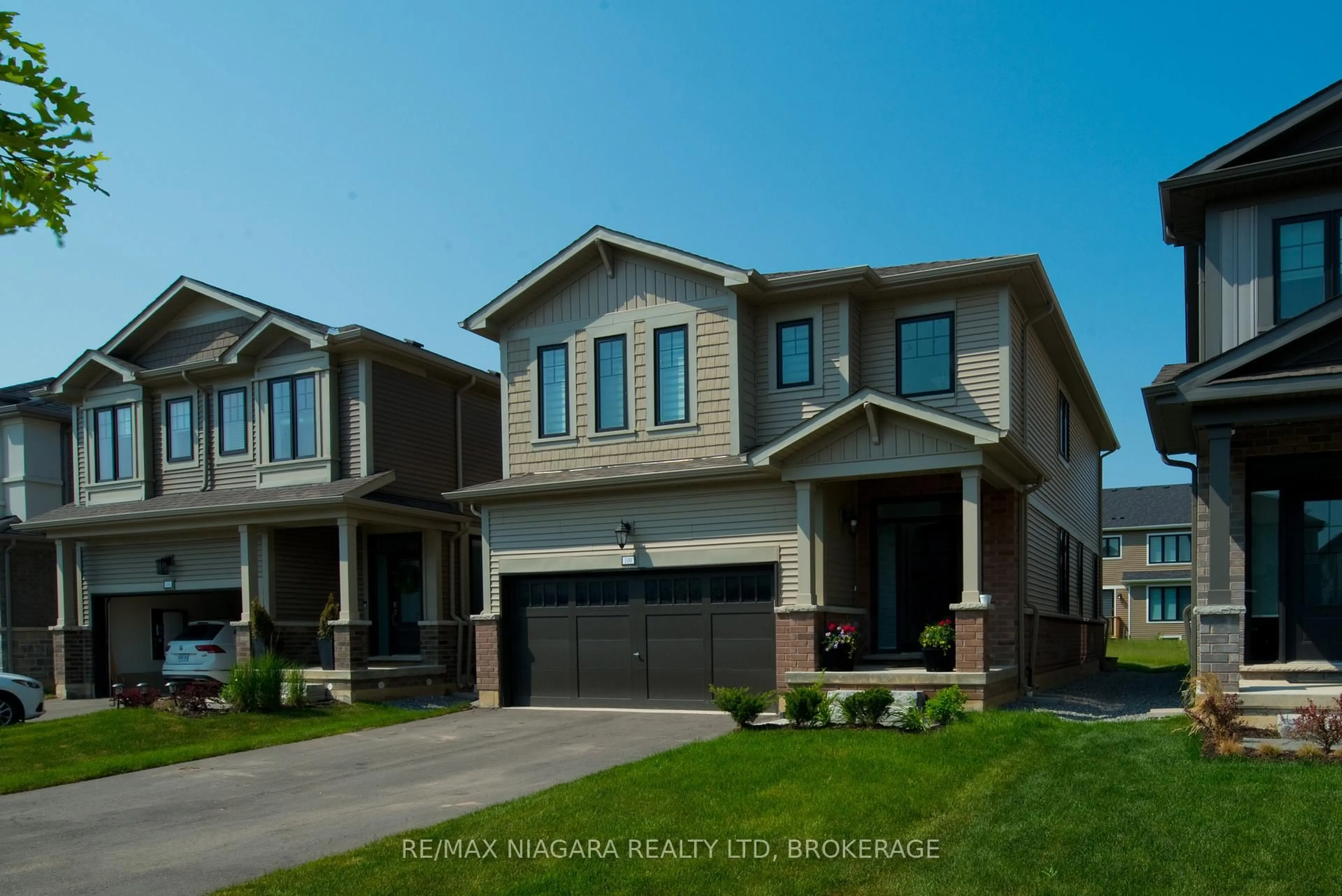 Home with brick exterior material, street for 100 Blackbird Way, Hamilton Ontario L0R 1W0