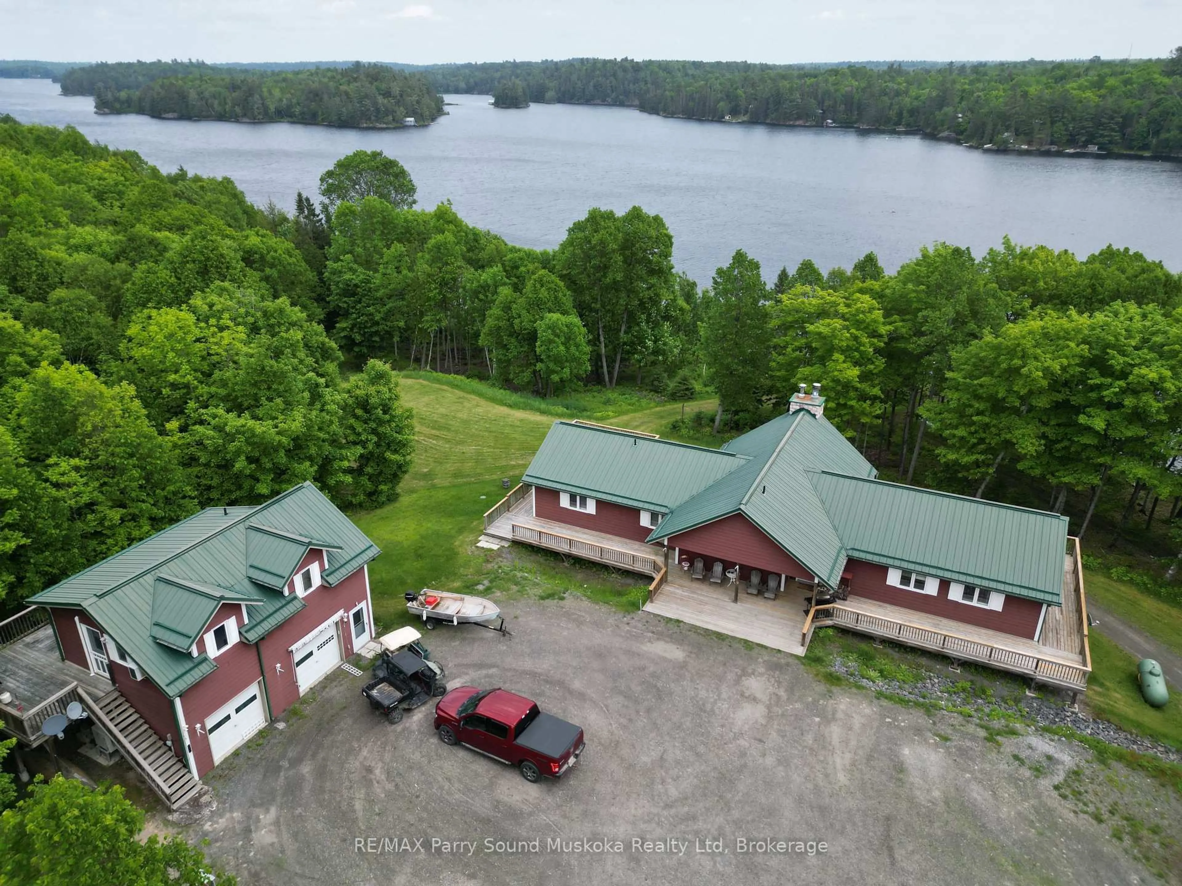 A pic from outside/outdoor area/front of a property/back of a property/a pic from drone, water/lake/river/ocean view for 1990 North Rd, Parry Sound Remote Area Ontario P0H 1S0