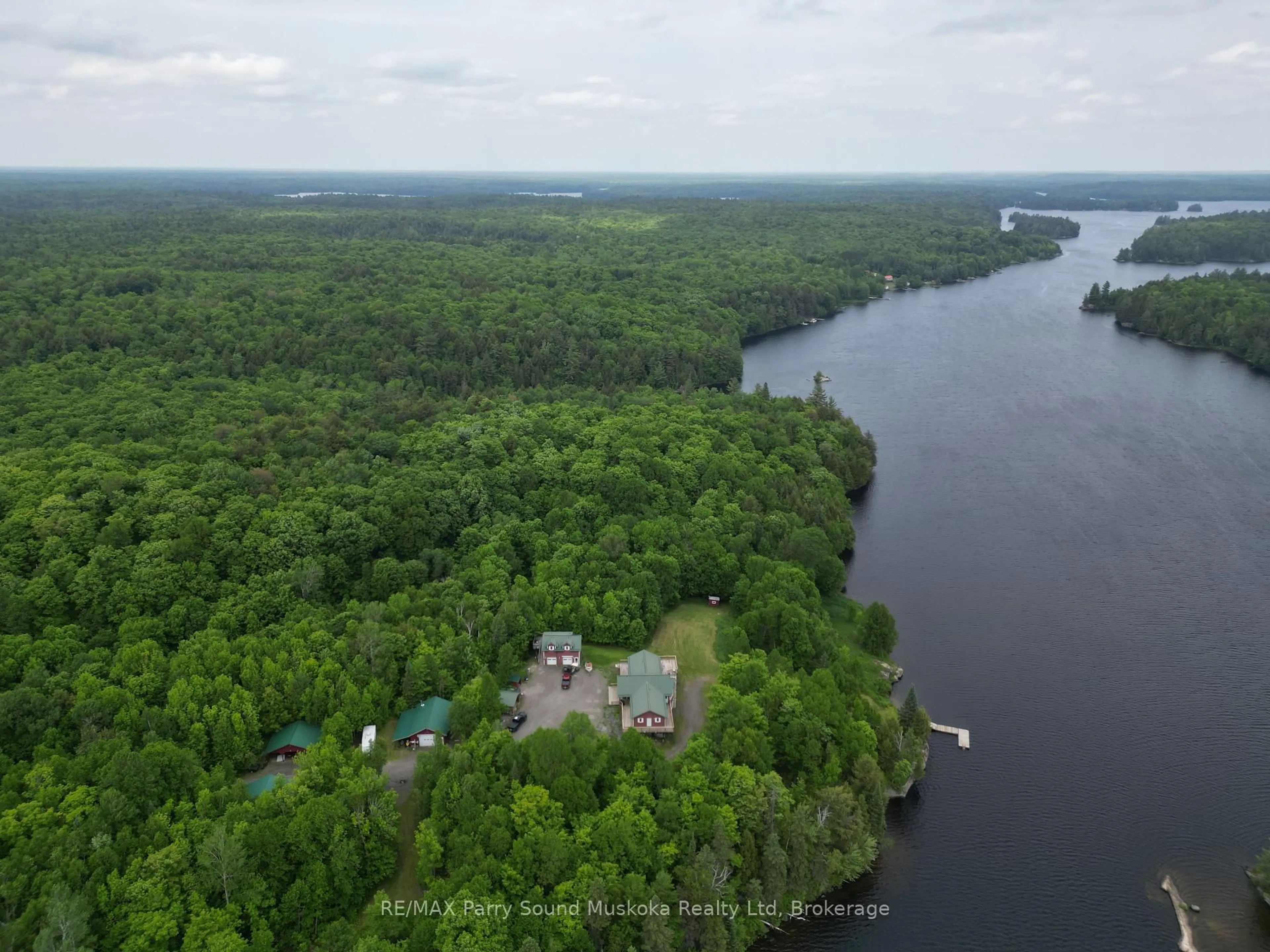 A pic from outside/outdoor area/front of a property/back of a property/a pic from drone, water/lake/river/ocean view for 1990 North Rd, Parry Sound Remote Area Ontario P0H 1S0