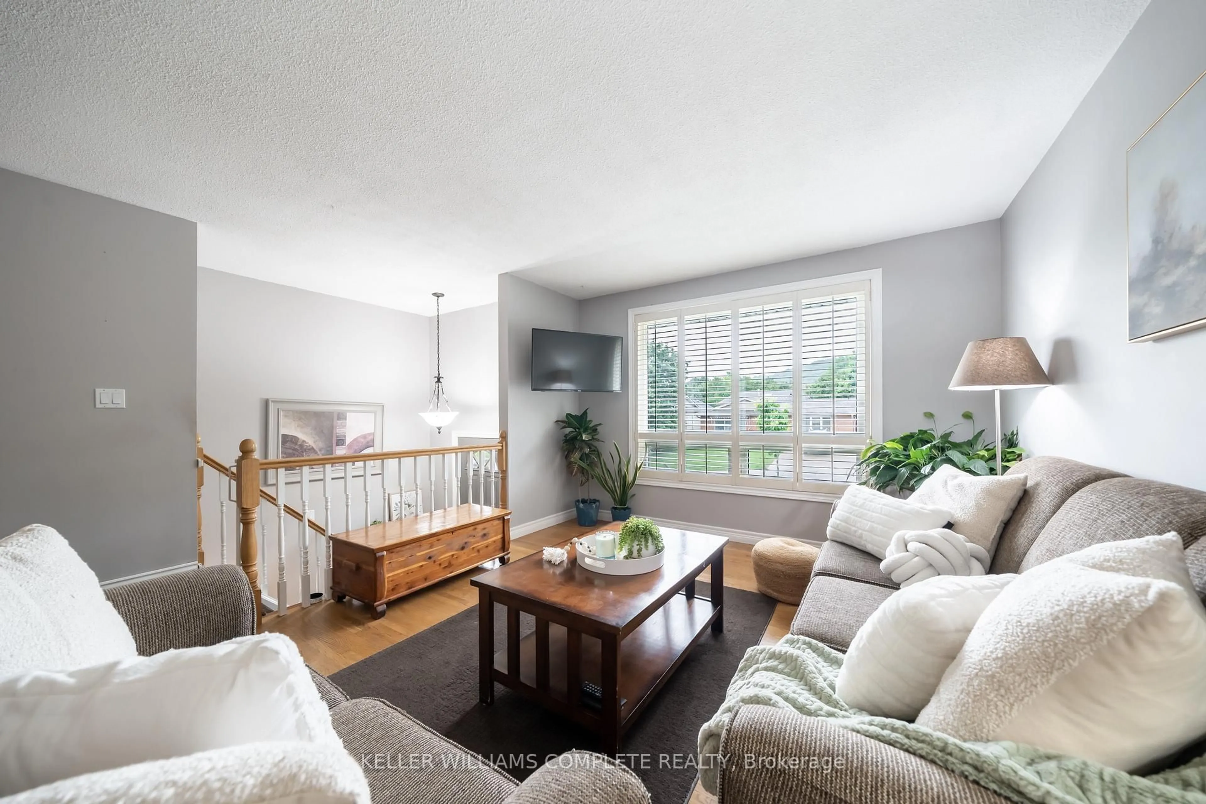 Living room with furniture, wood/laminate floor for 82 Bunker Hill Dr, Hamilton Ontario L8K 5X4