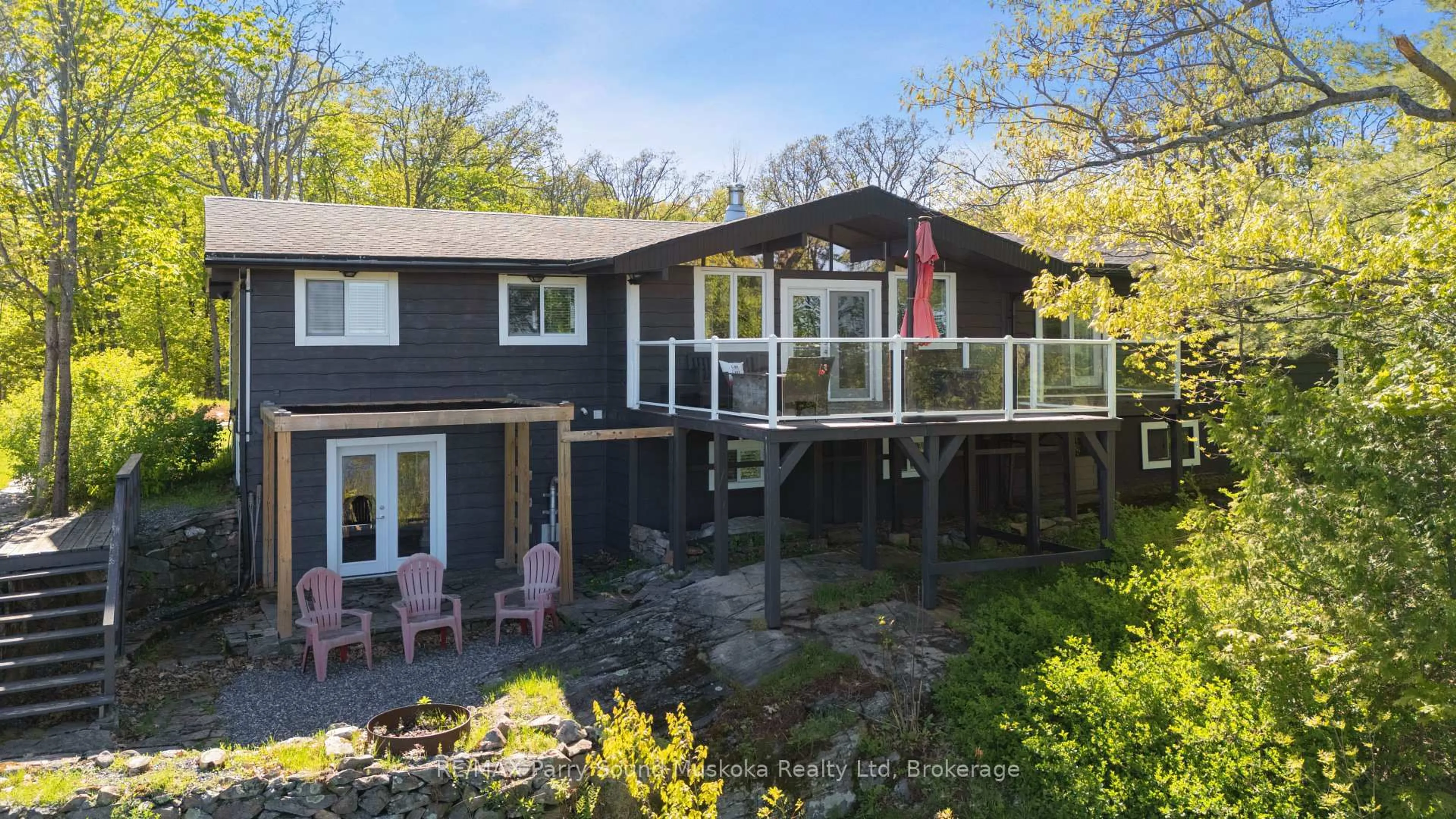 A pic from outside/outdoor area/front of a property/back of a property/a pic from drone, water/lake/river/ocean view for 143A Highway 612, Seguin Ontario P0C 1H0