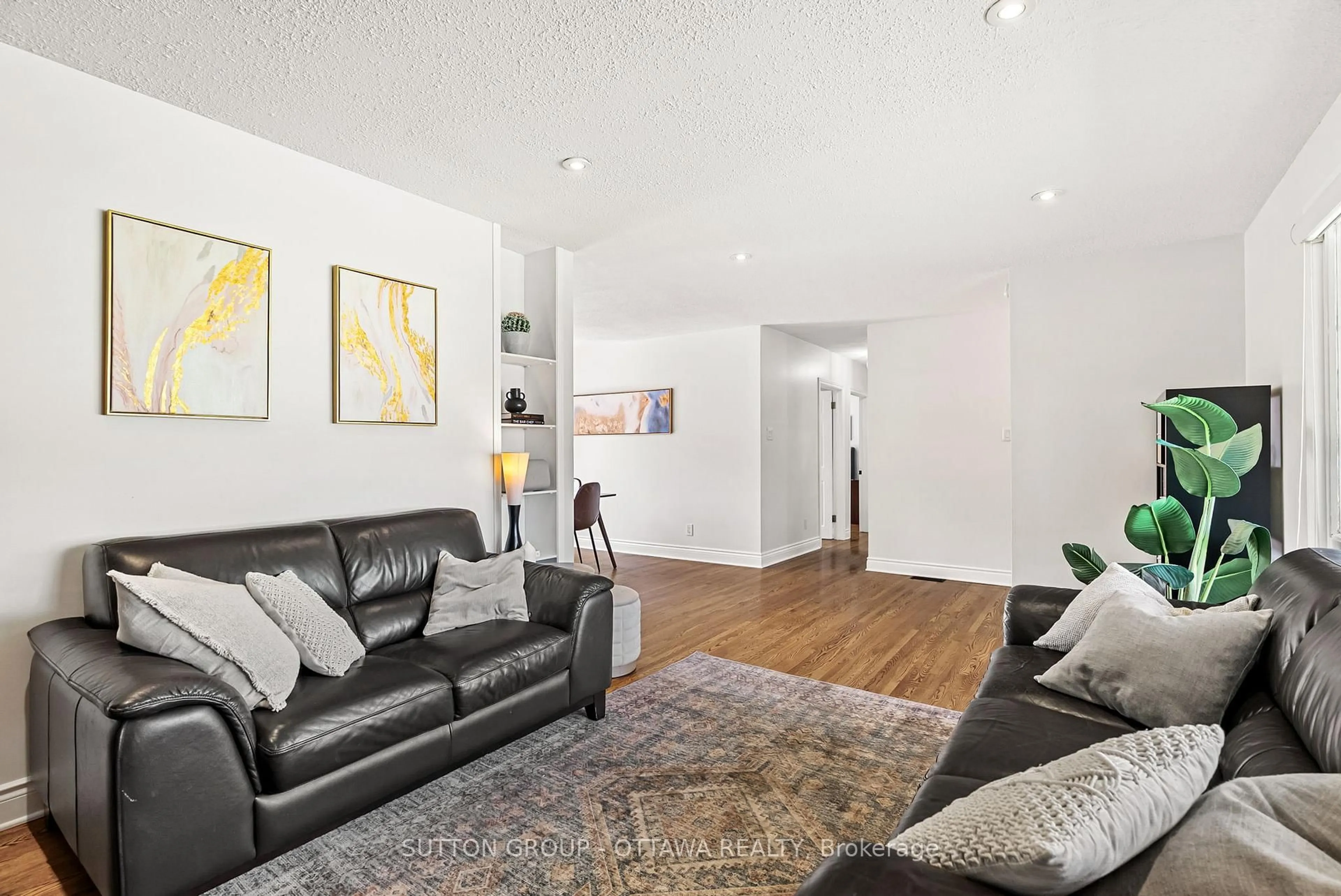 Living room with furniture, wood/laminate floor for 19 Donland Ave, Ottawa Ontario K2G 3A4